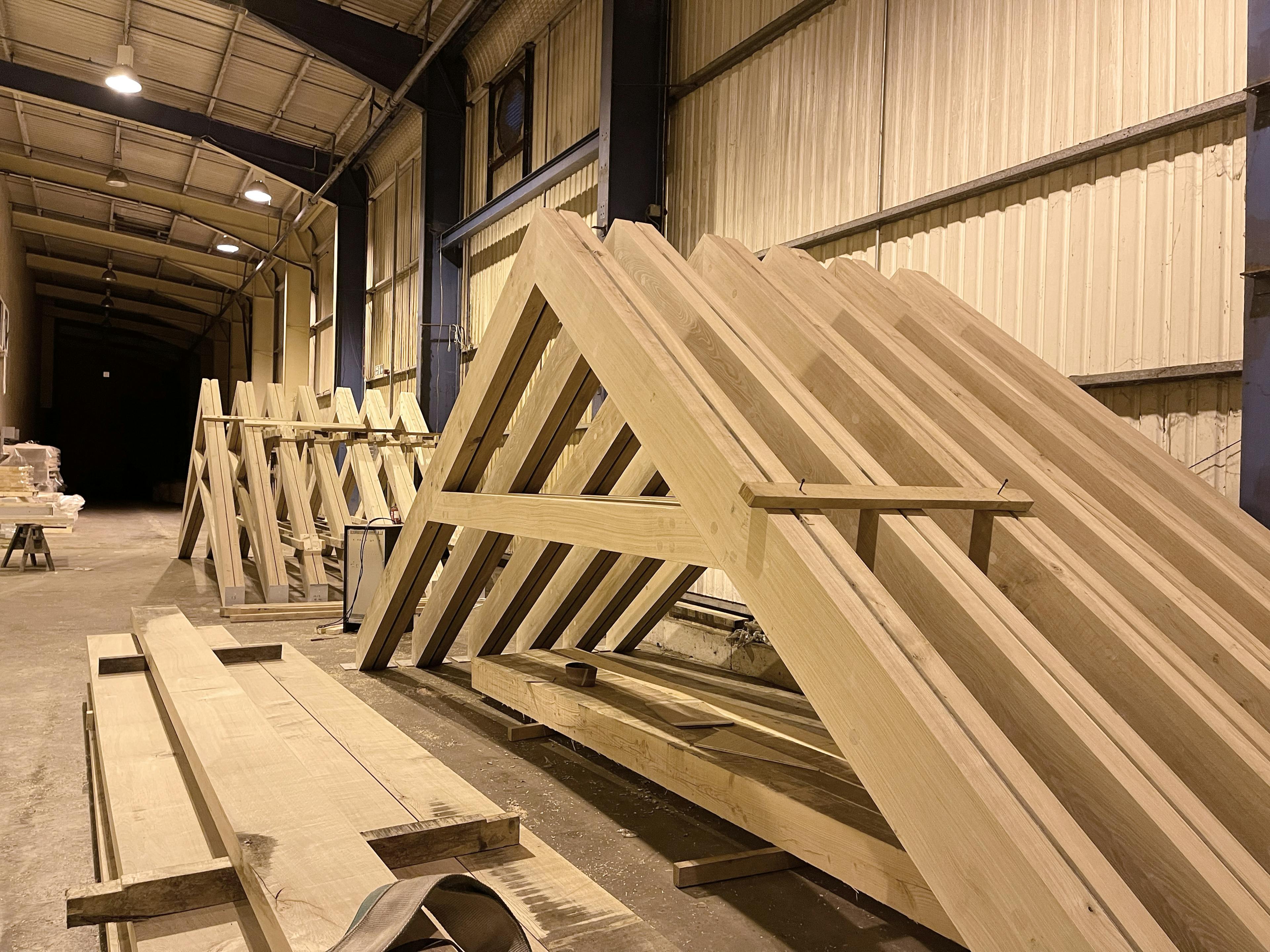 Air dried oak scissor trusses for a roof in a school building in a workshop