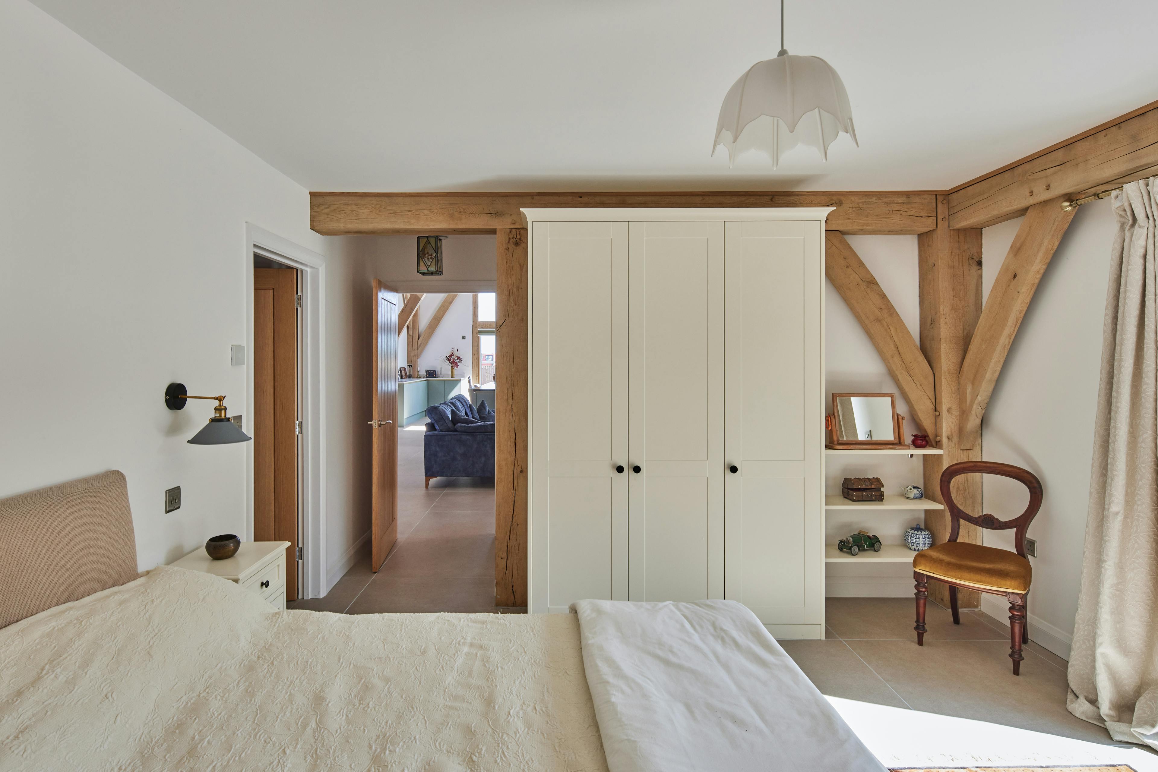 An oak framed bedroom on the ground floor of an oak framed home