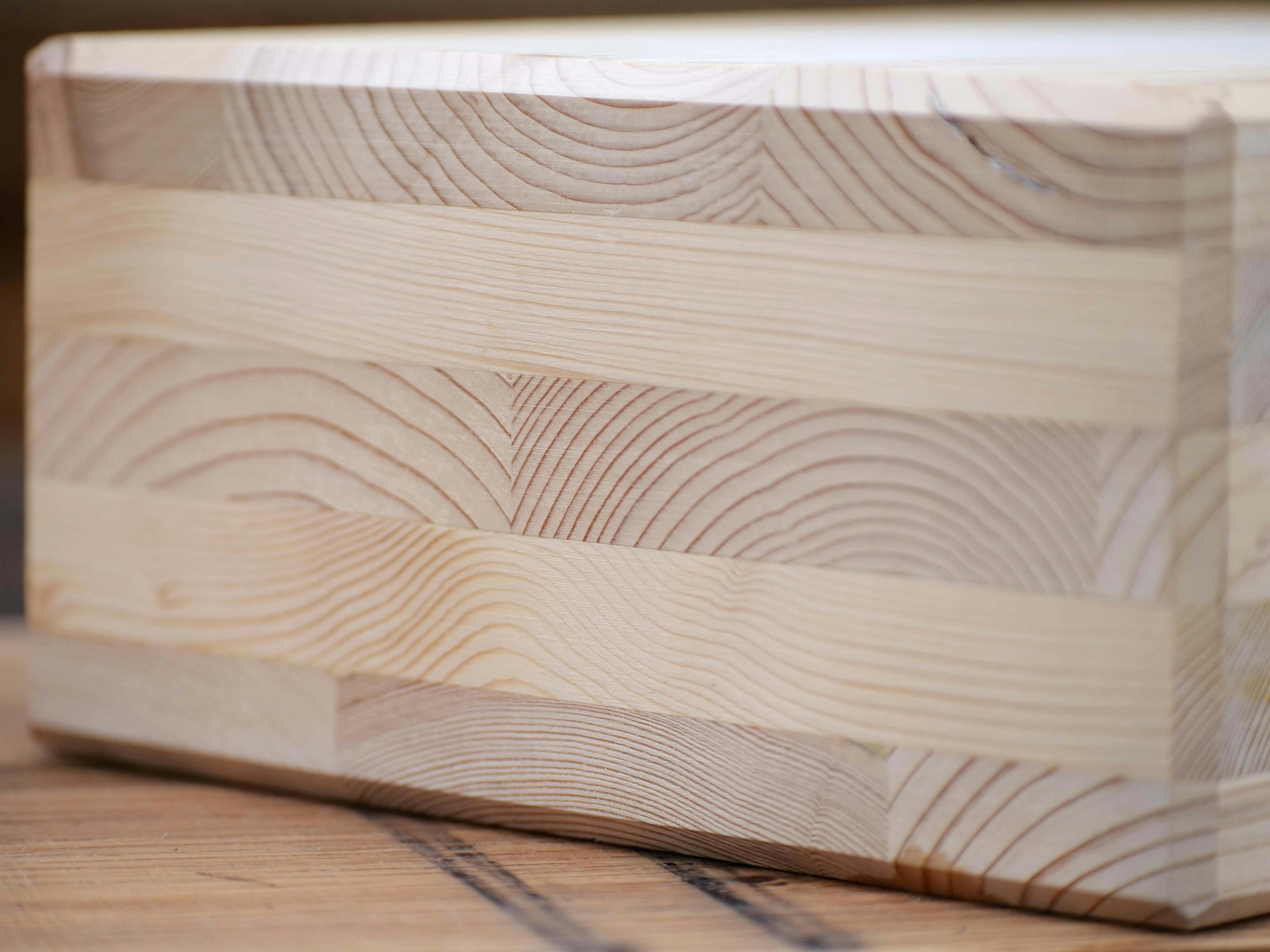 Close-up swatch of CLT (Cross-Laminated Timber) highlighting its texture and layered composition