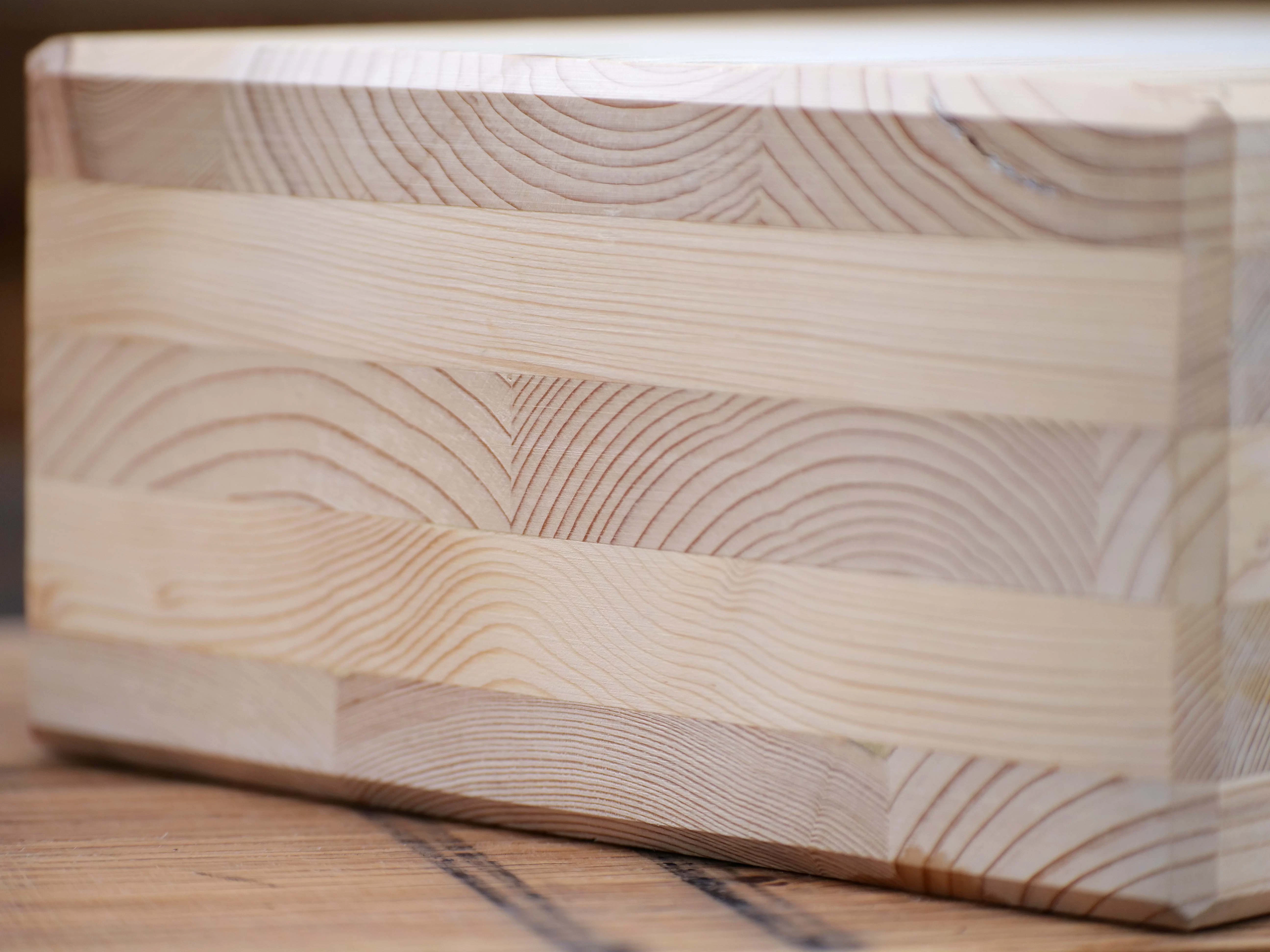 Close-up swatch of CLT (Cross-Laminated Timber) highlighting its texture and layered composition