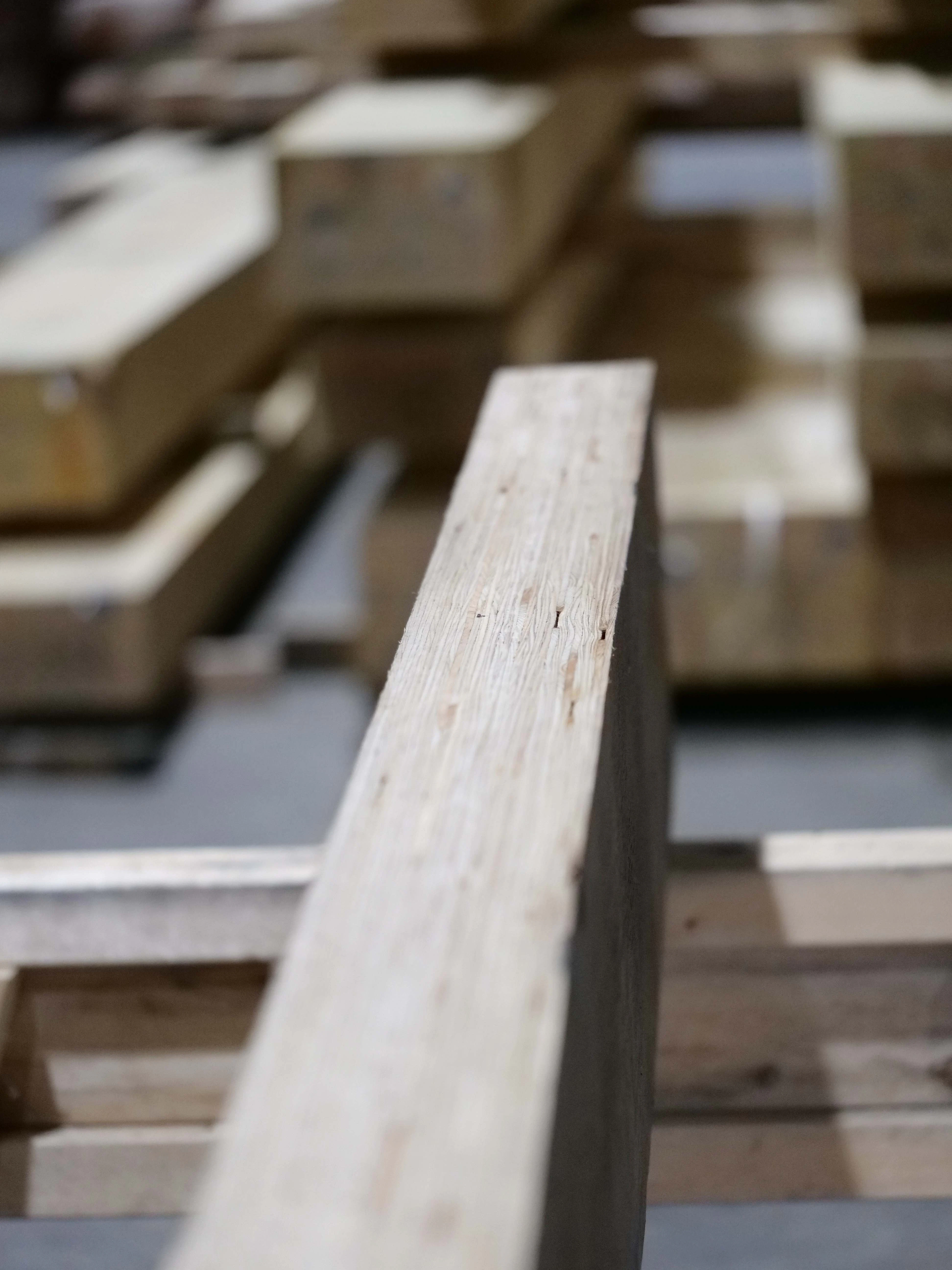 Close-up detail of LVL (Laminated Veneer Lumber) showcasing its layered structure and grain pattern