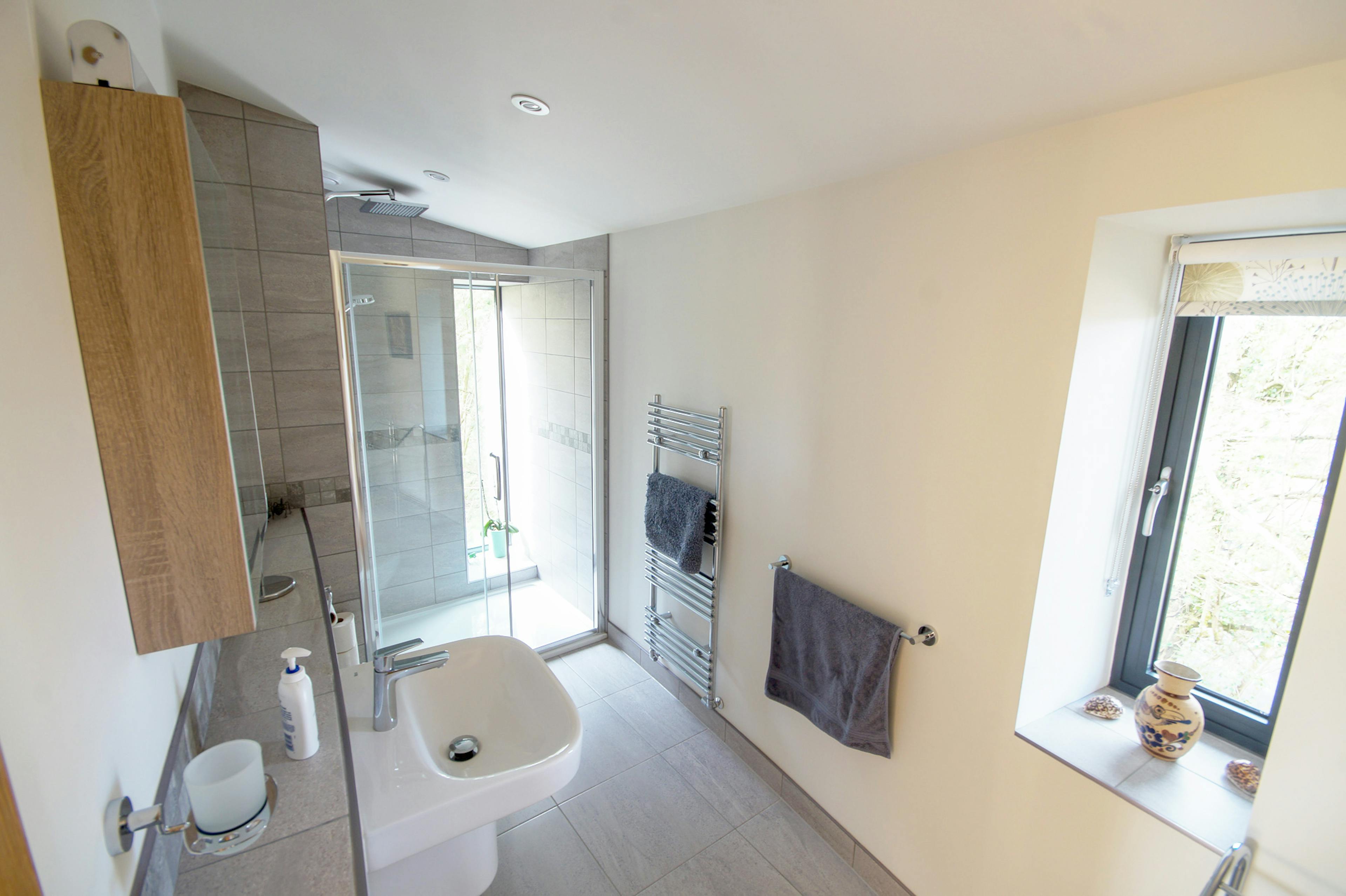 An bathroom in a curved oak frame home