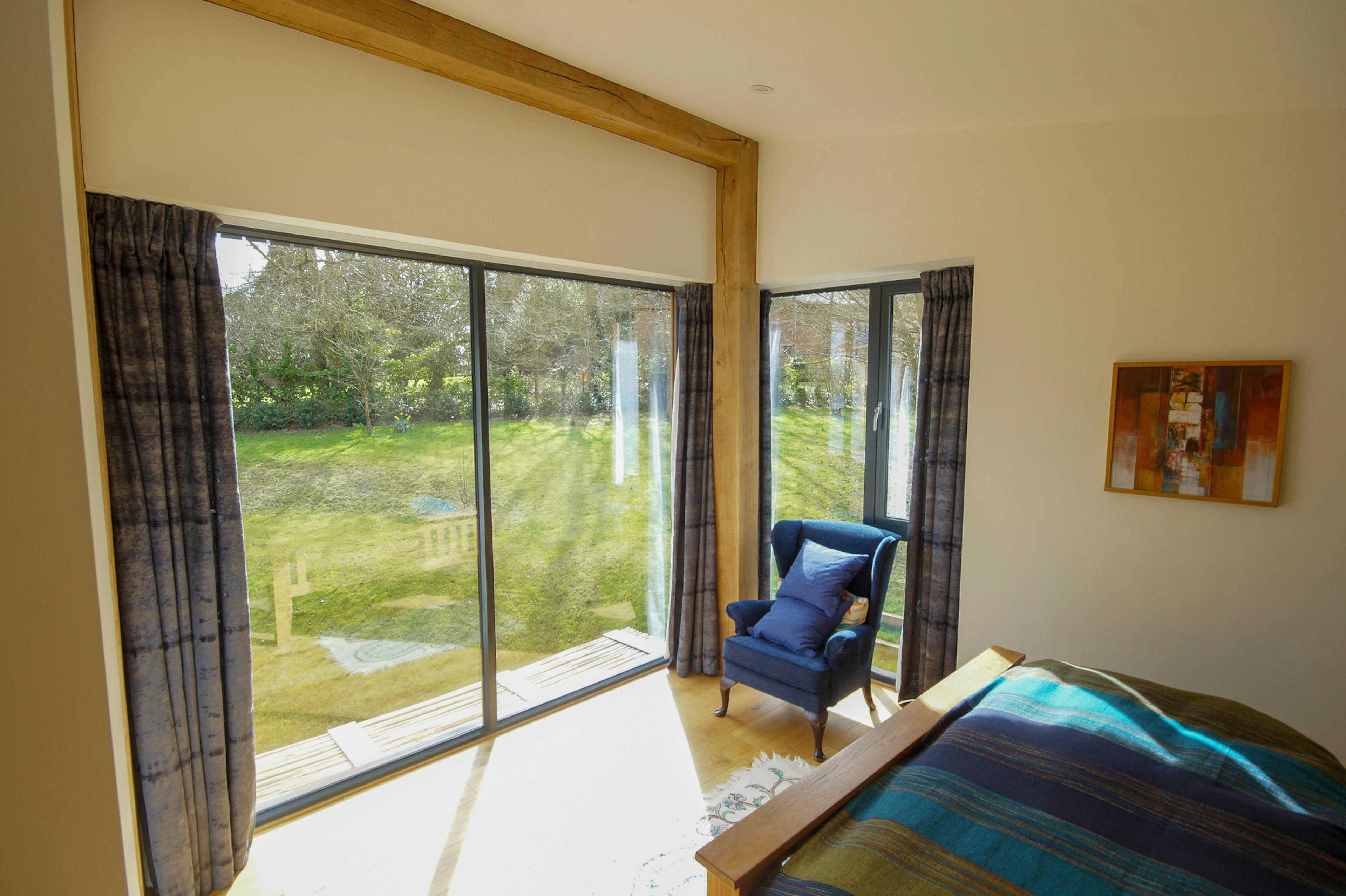 An bedroom in a curved oak frame home