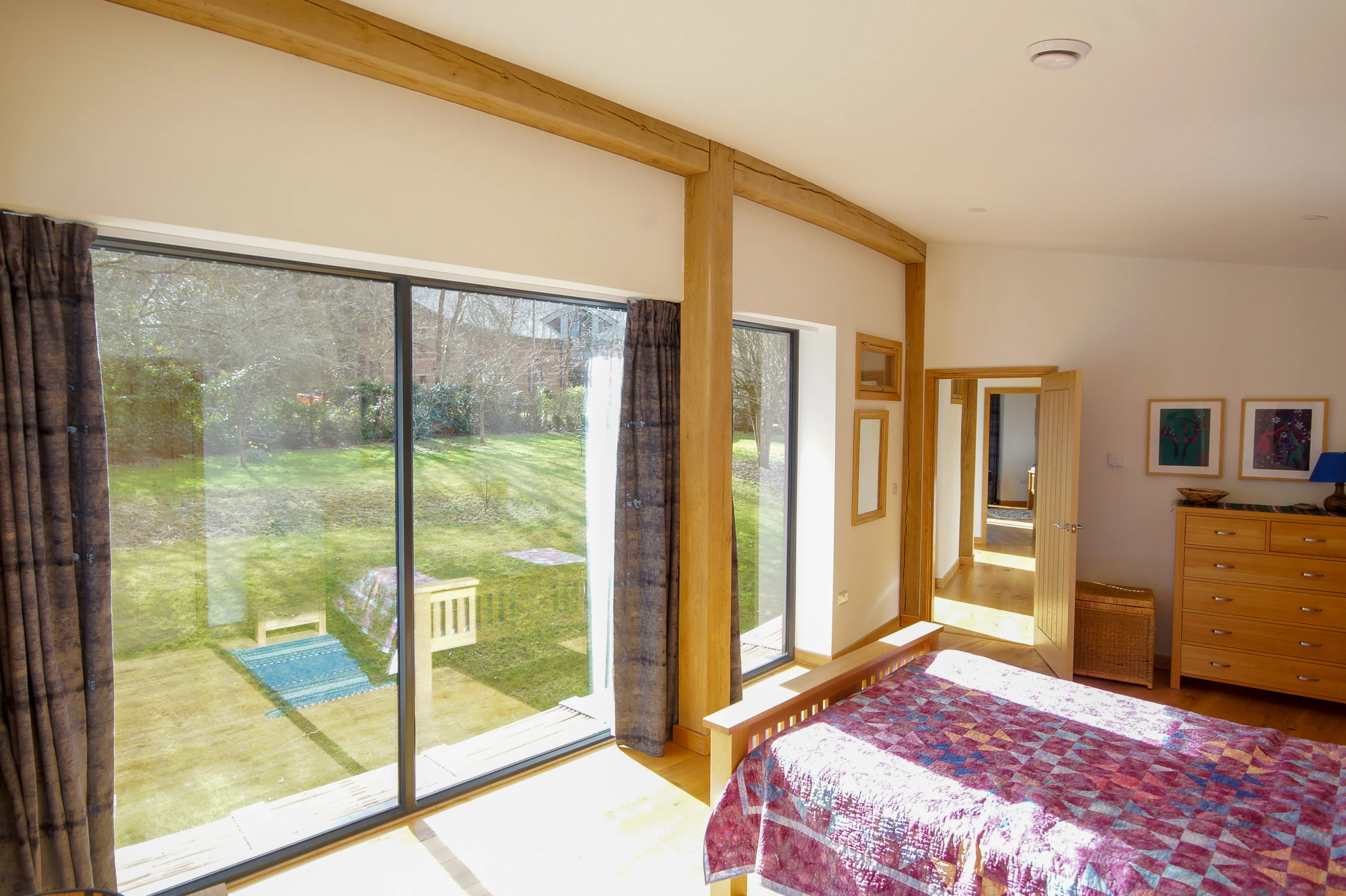 An bedroom in a curved oak frame home