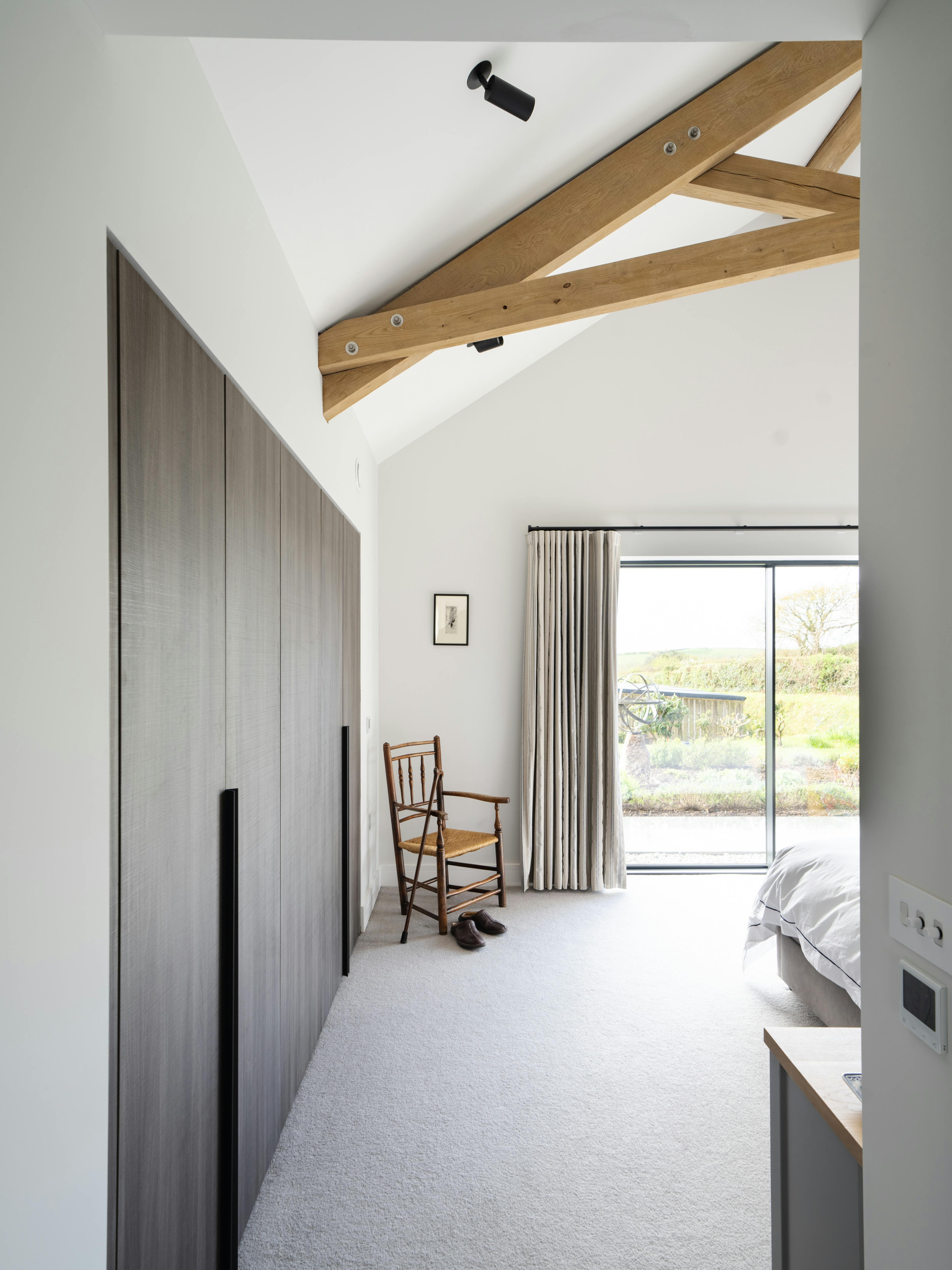 A master bedroom with an oak truss