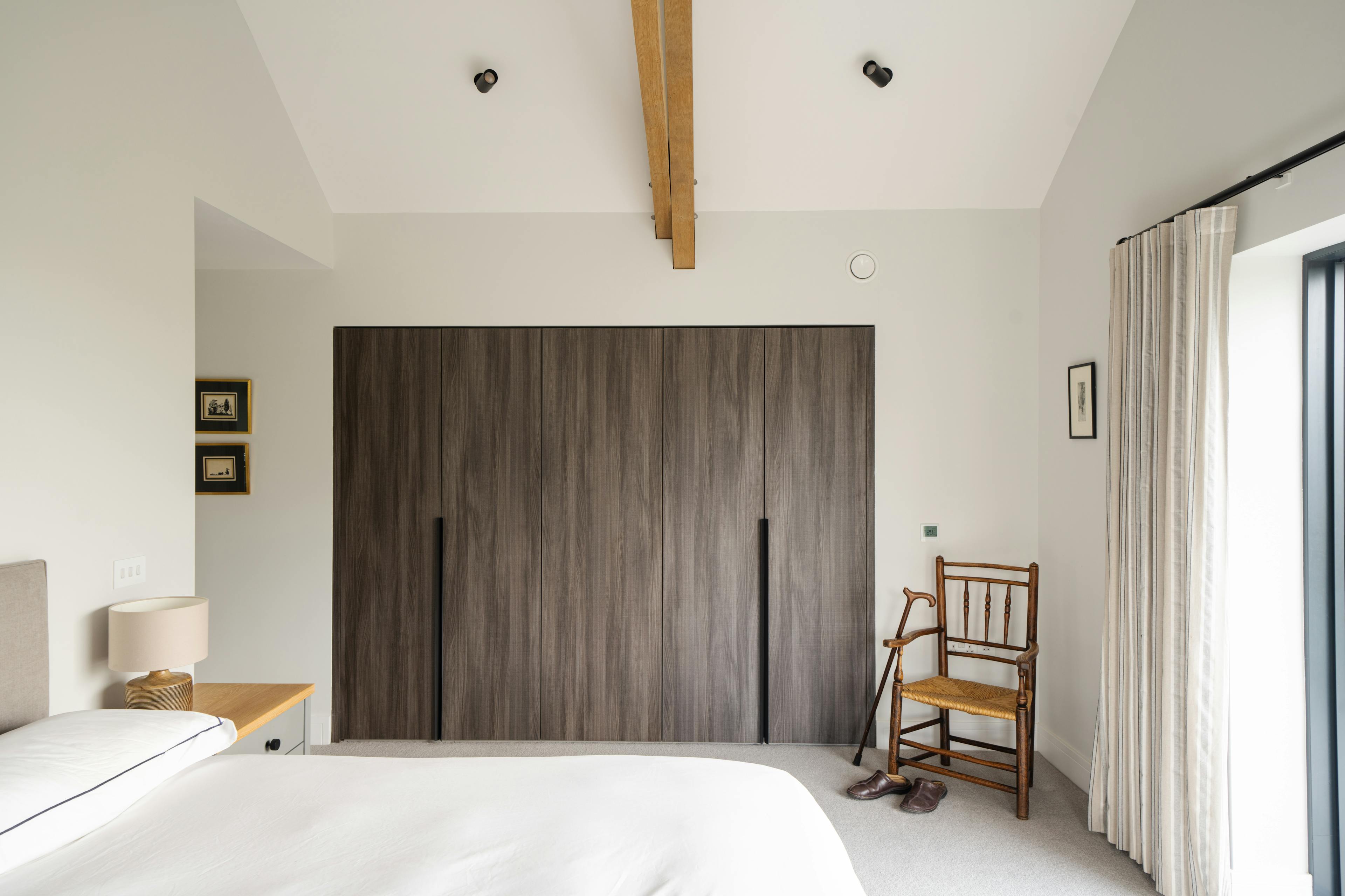 A master bedroom with an oak truss