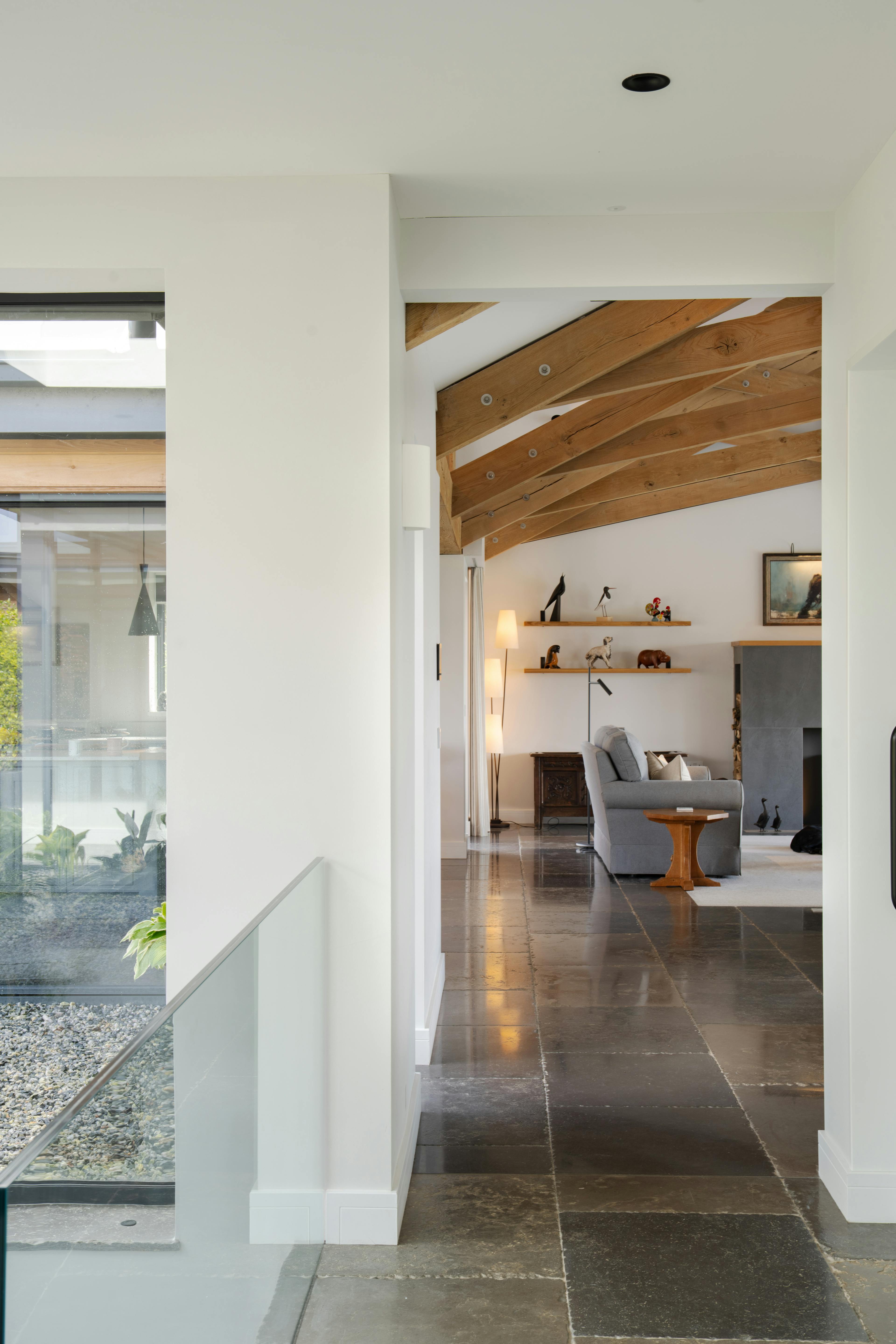 A doorway into an oak framed living room