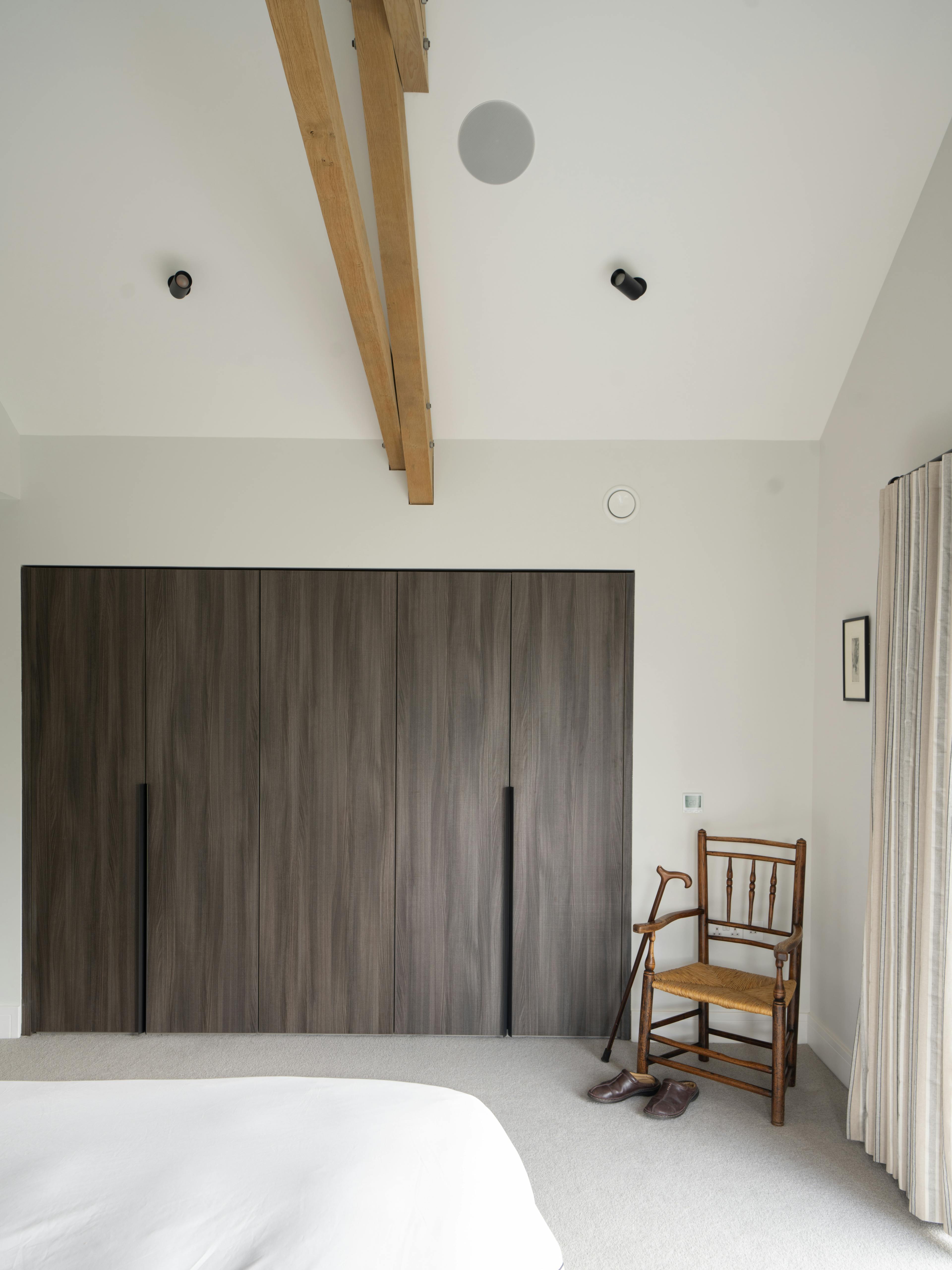 A master bedroom with an oak truss