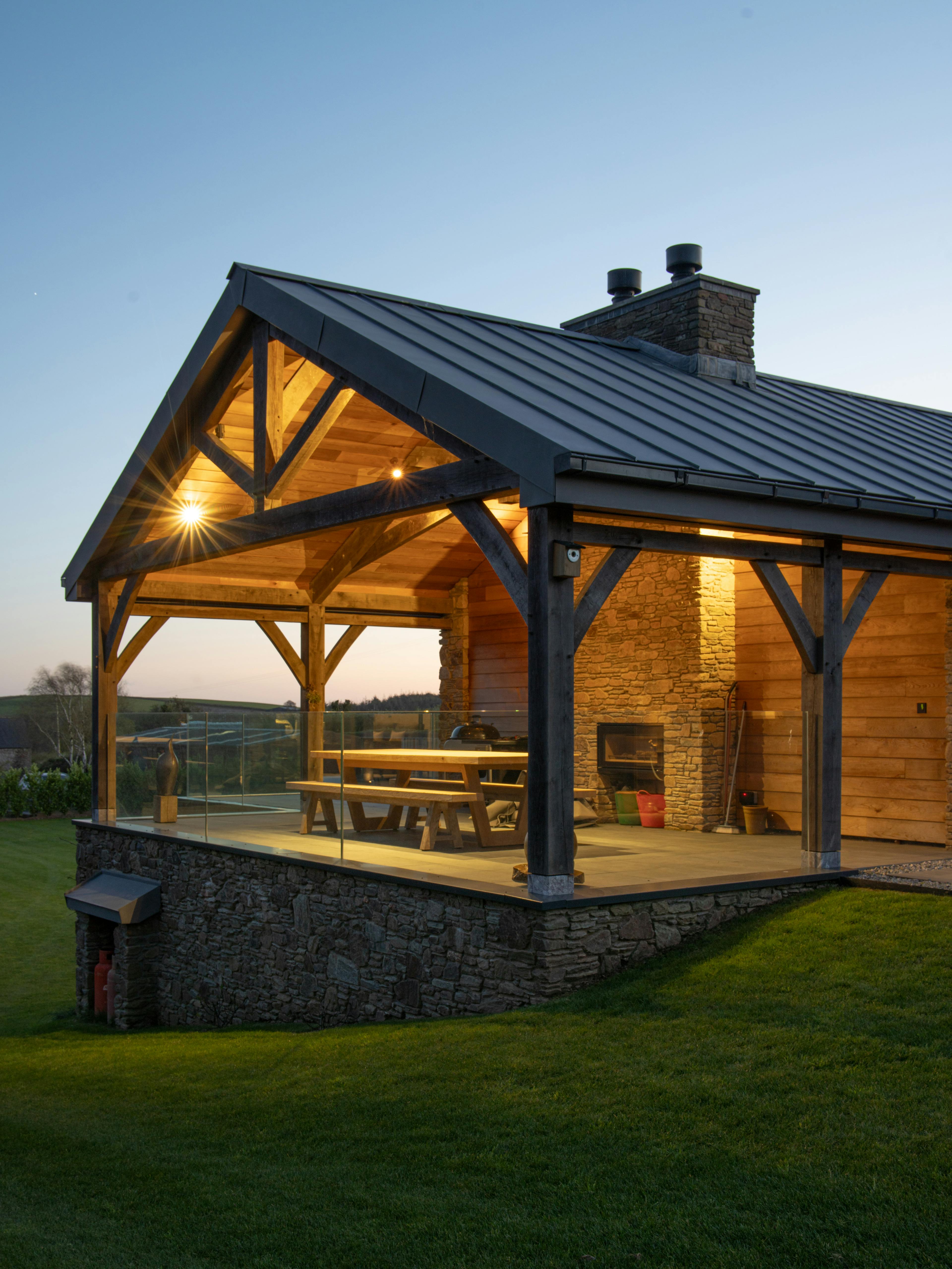 A covered outdoor eating area with an oak frame