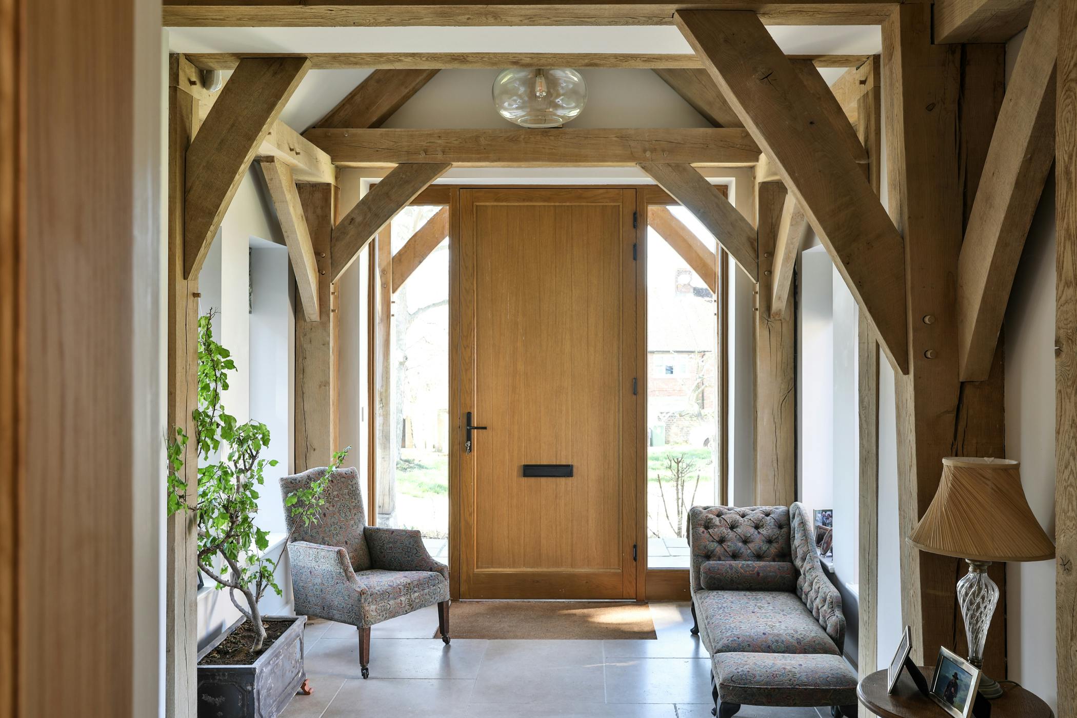 An oak framed entranceway and wooden front door