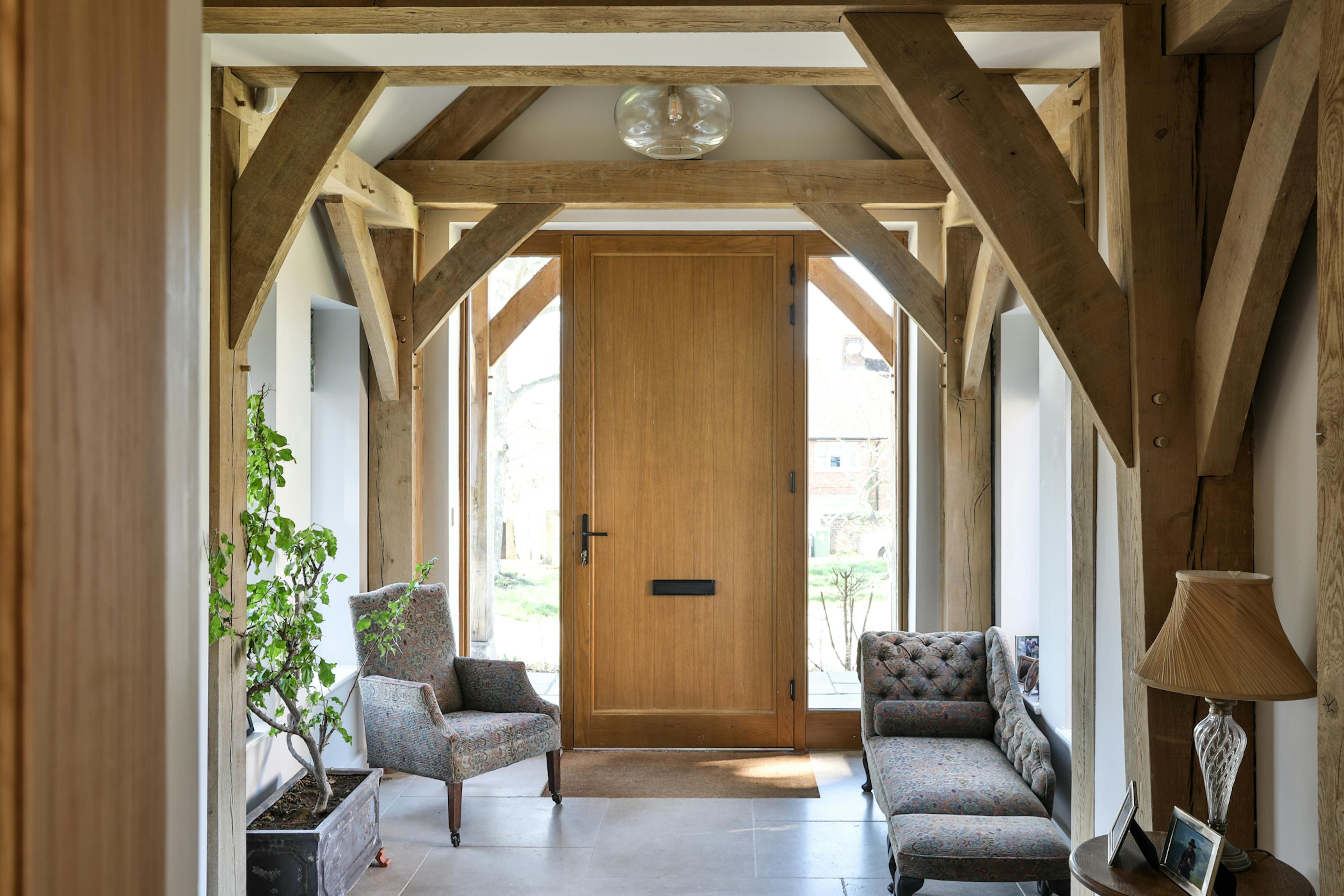 An oak framed entranceway and wooden front door