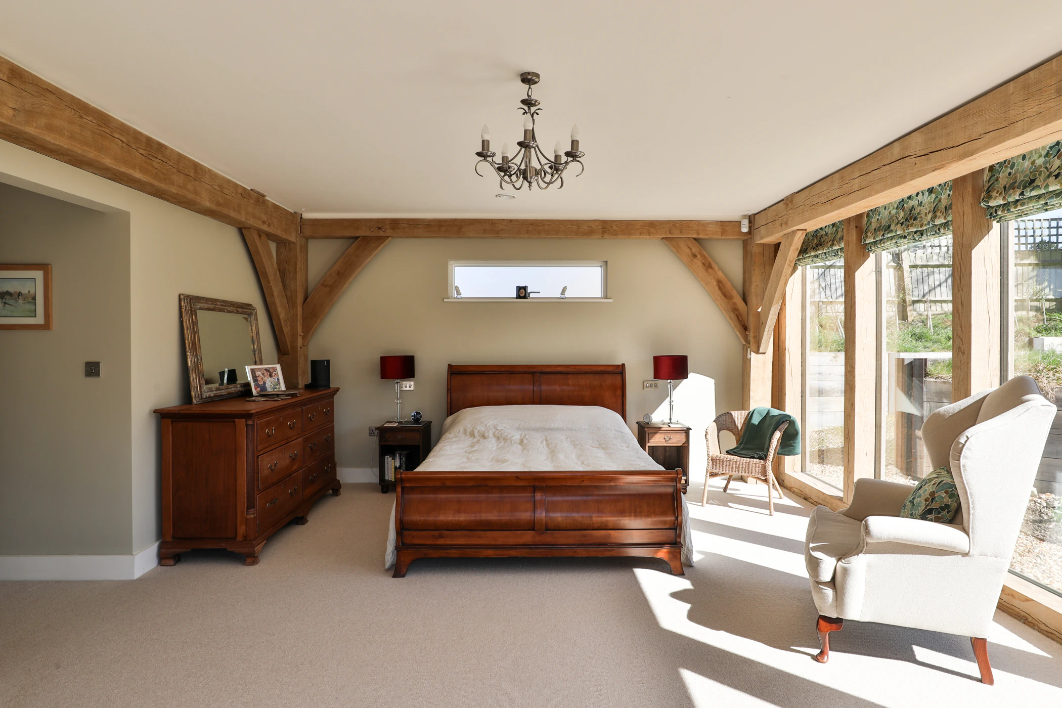 An oak framed bedroom with large direct glazed windows