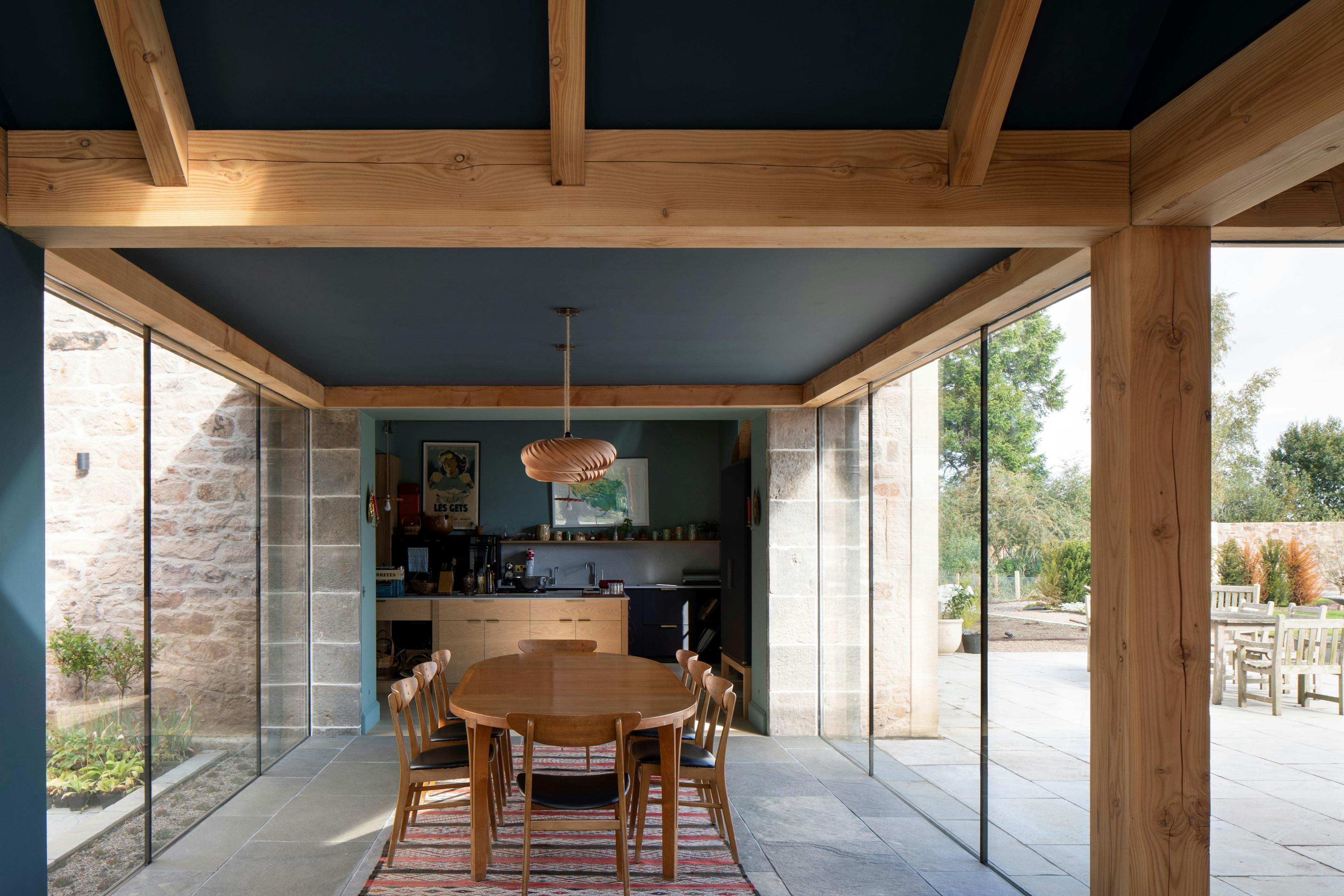 Douglas fir framed dining room extension with glazing