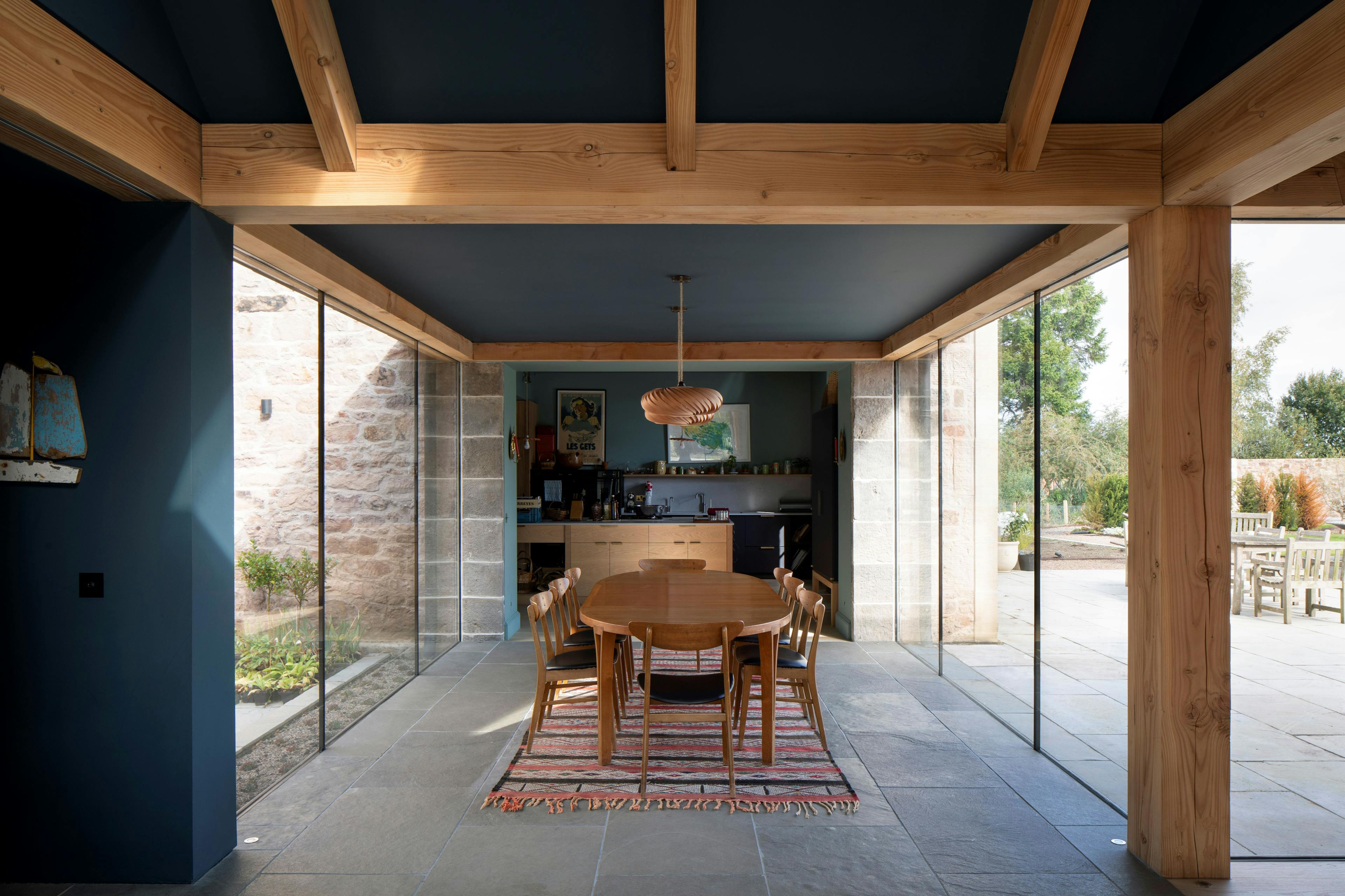 Douglas fir framed dining room extension with glazing