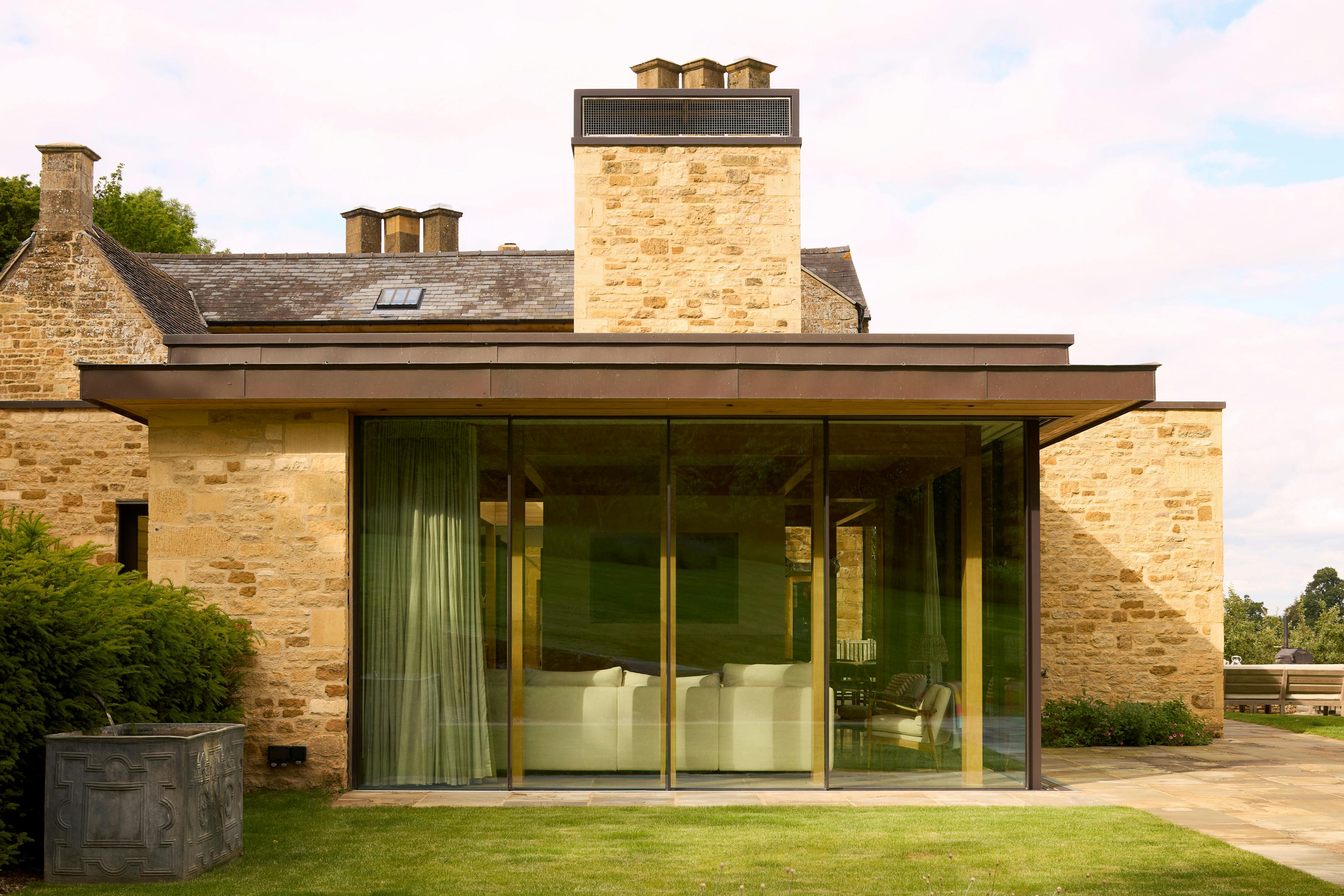 Exterior of an oak glulam extension to a listed manor house