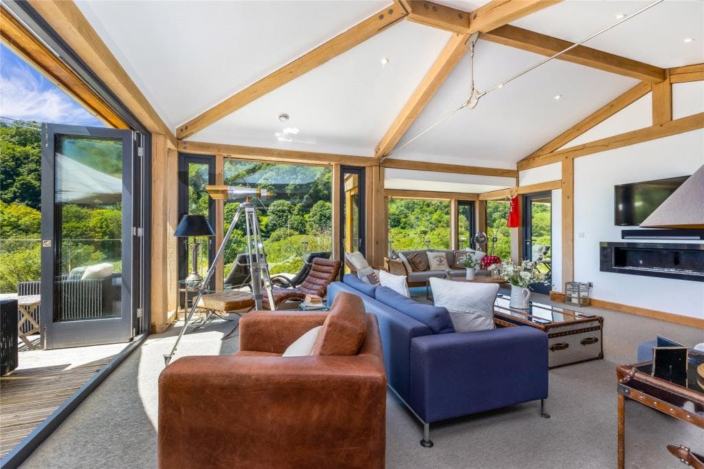Interior of modern timber framed house showing living room