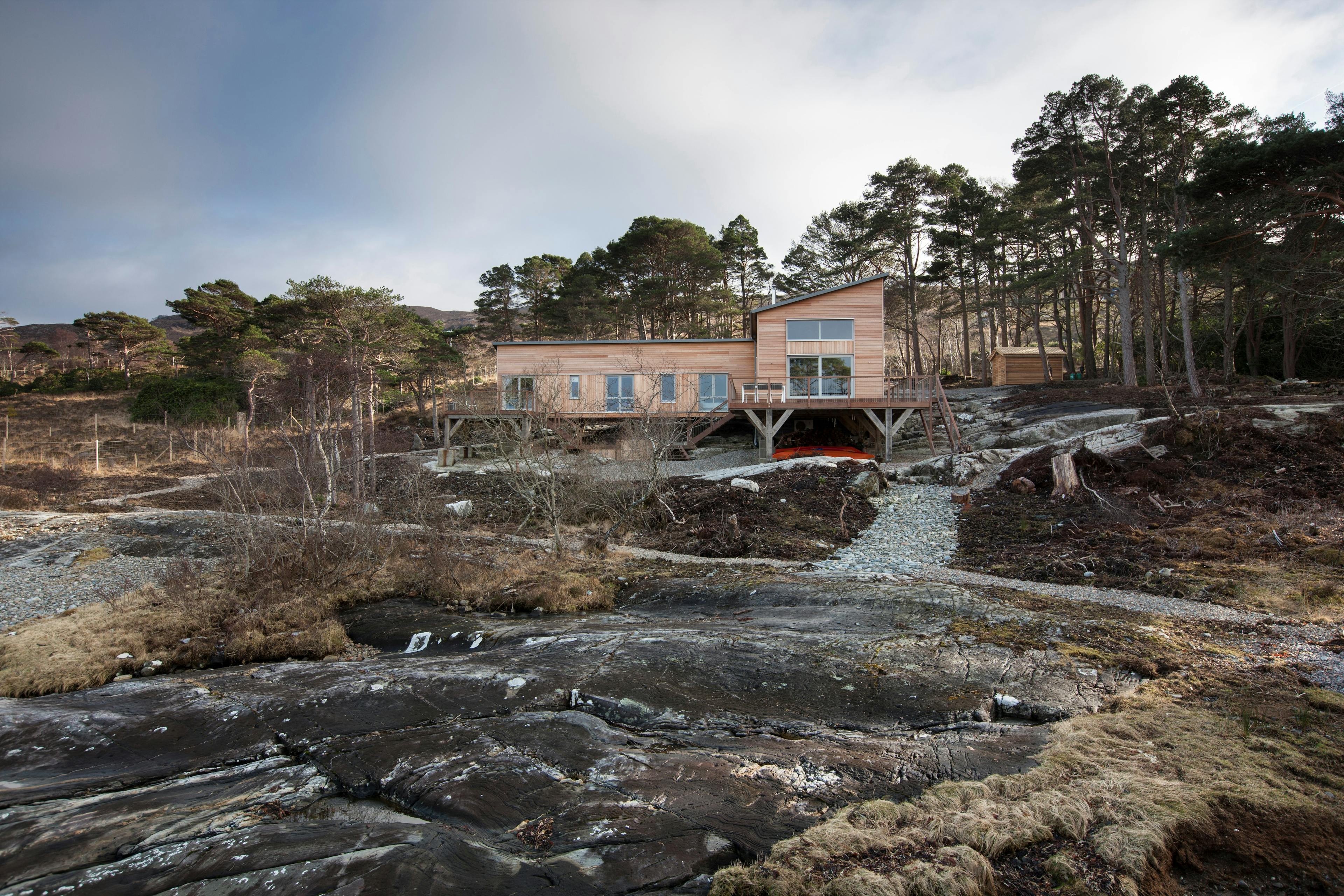 Exterior image of loch side timber framed home
