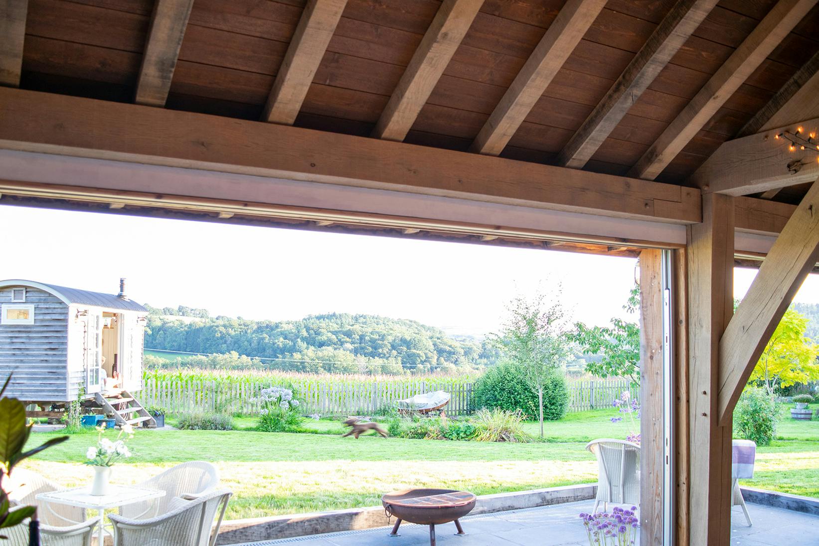 A view of a garden from an oak framed extension