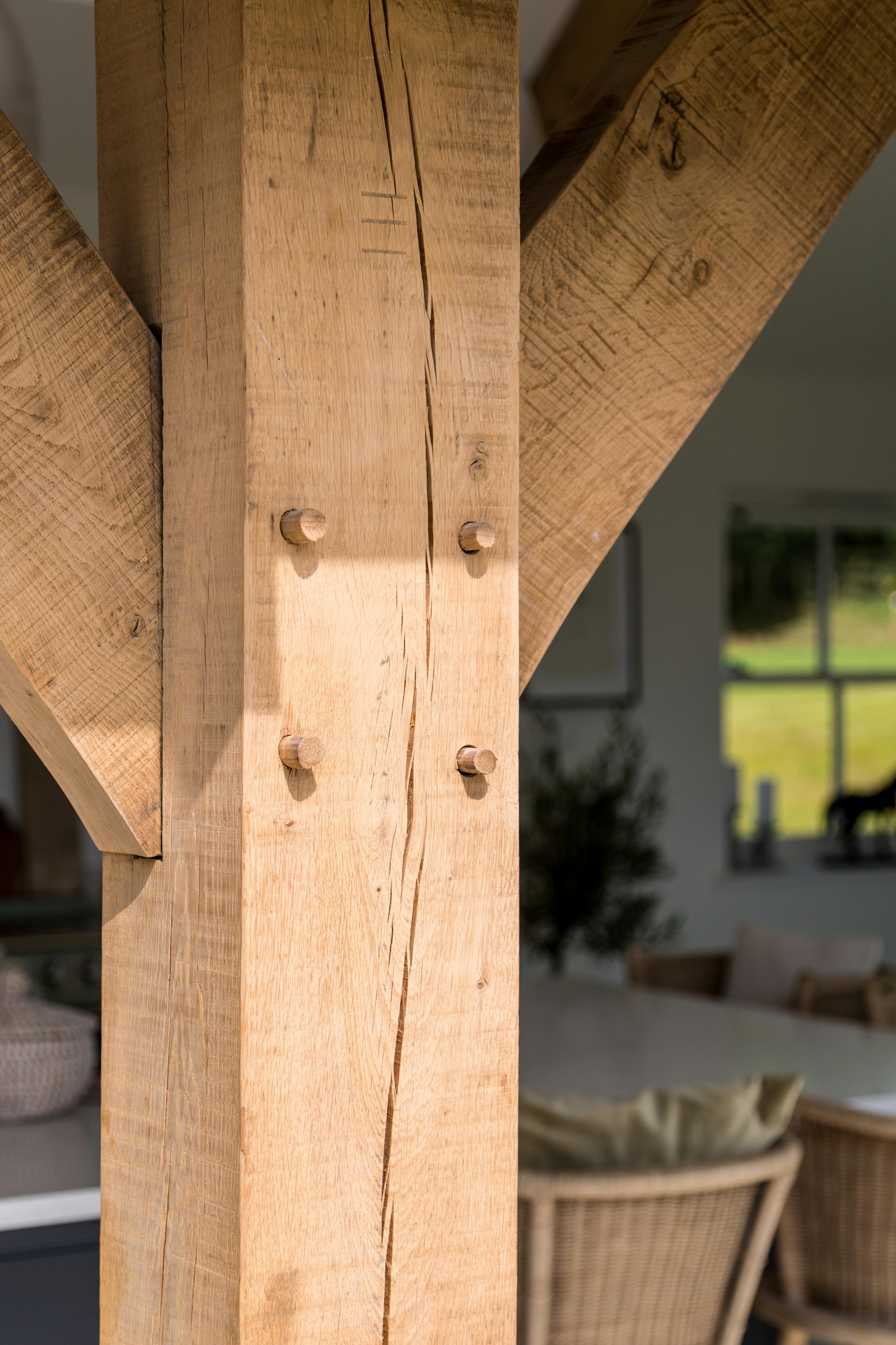 Internal view of oak framed kitchen, close up detail of mortice and tenon joinery