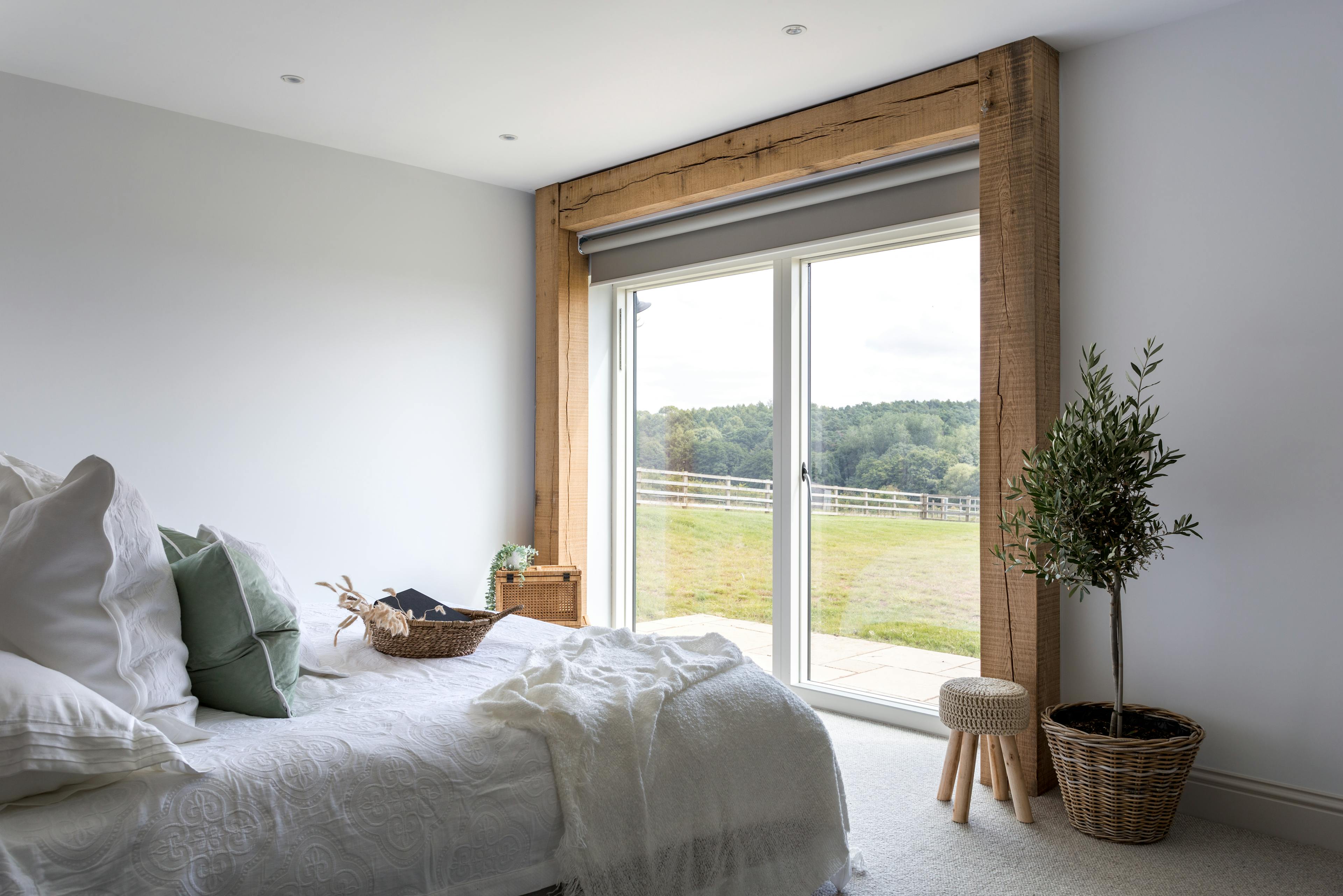 Internal view of bedroom with oak framed window