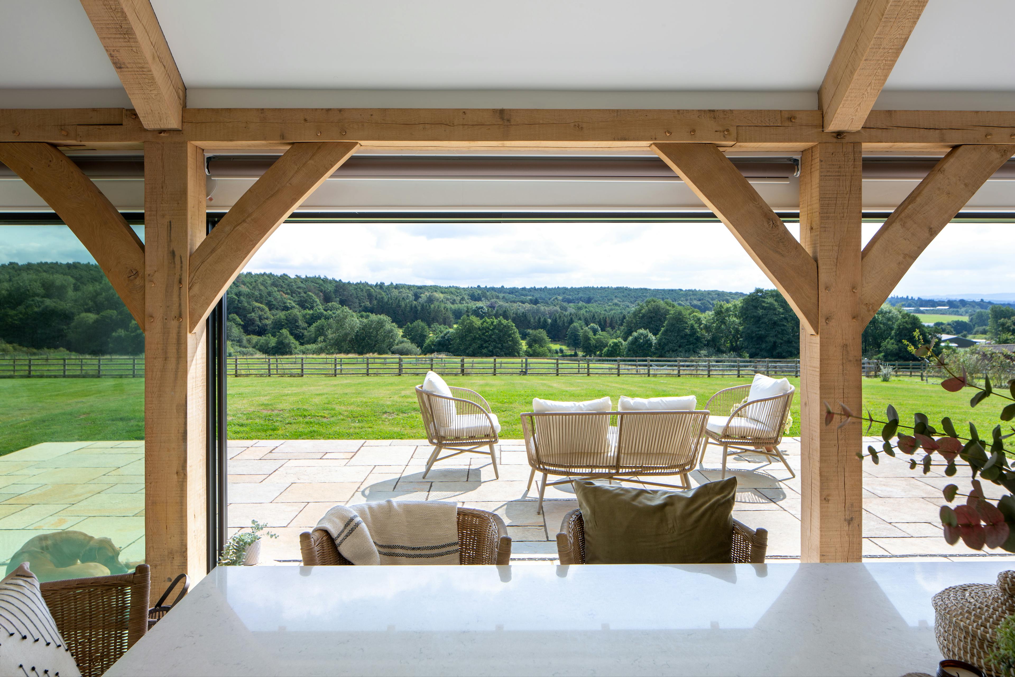 Internal view of kitchen with oak joinery screen glazing 