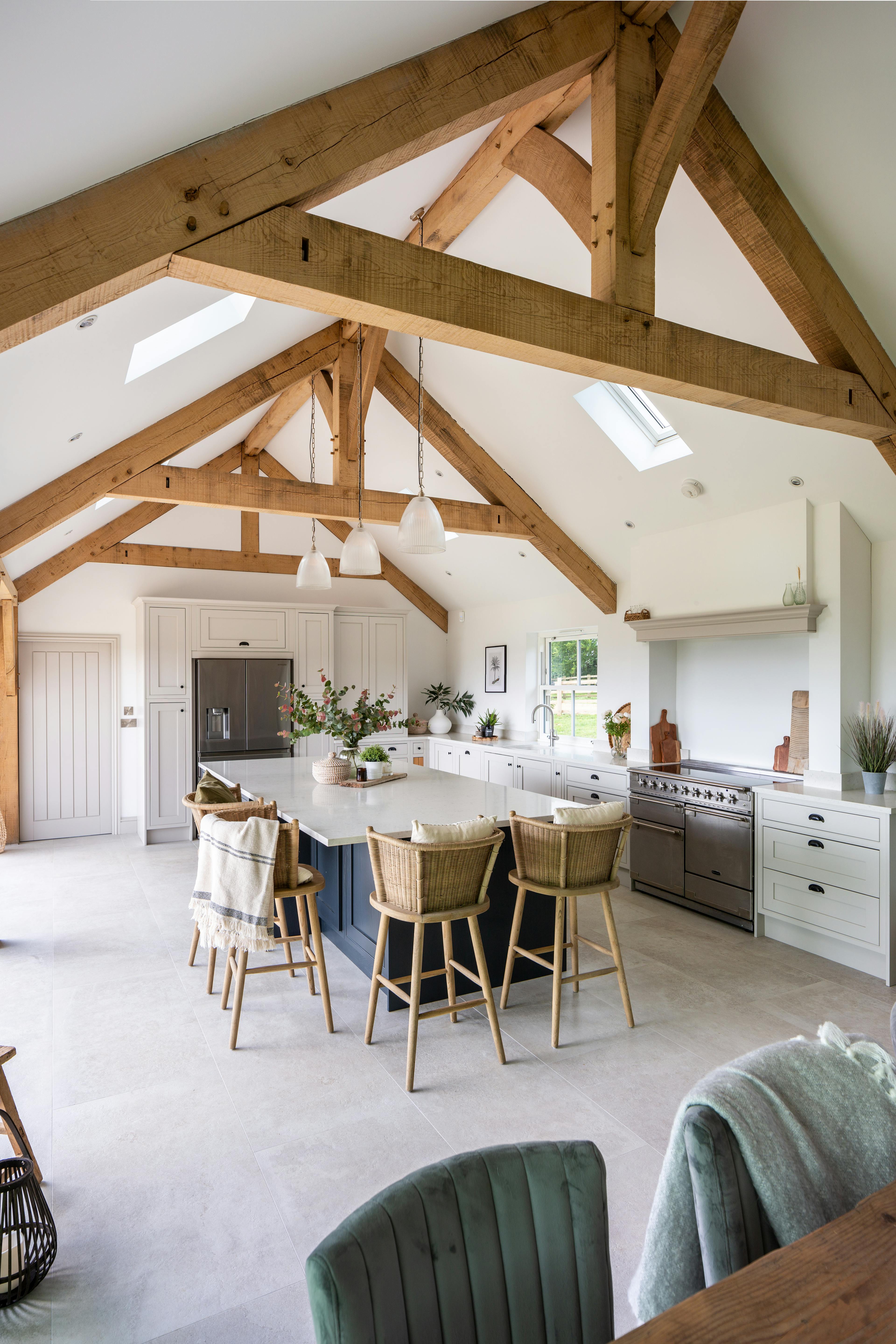 Interior view of a stunning vaulted kitchen with oak framing and raised collar trusses