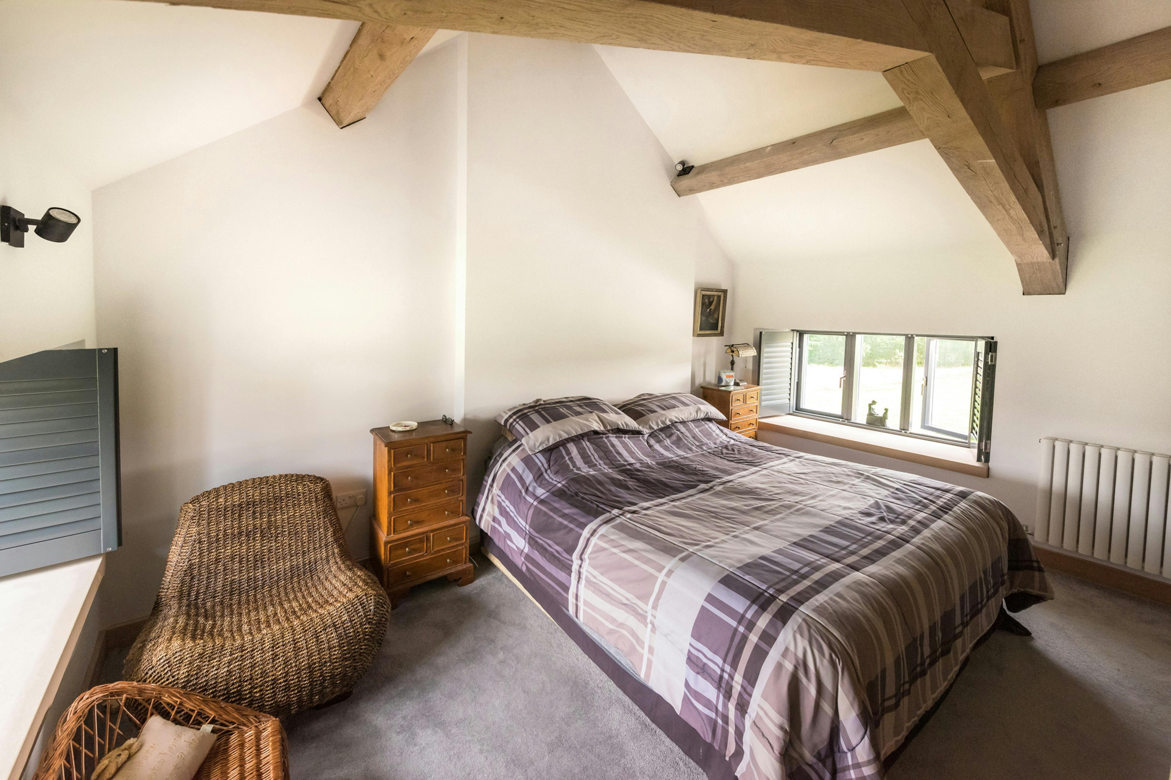 Interior view of a oak-framed bedroom