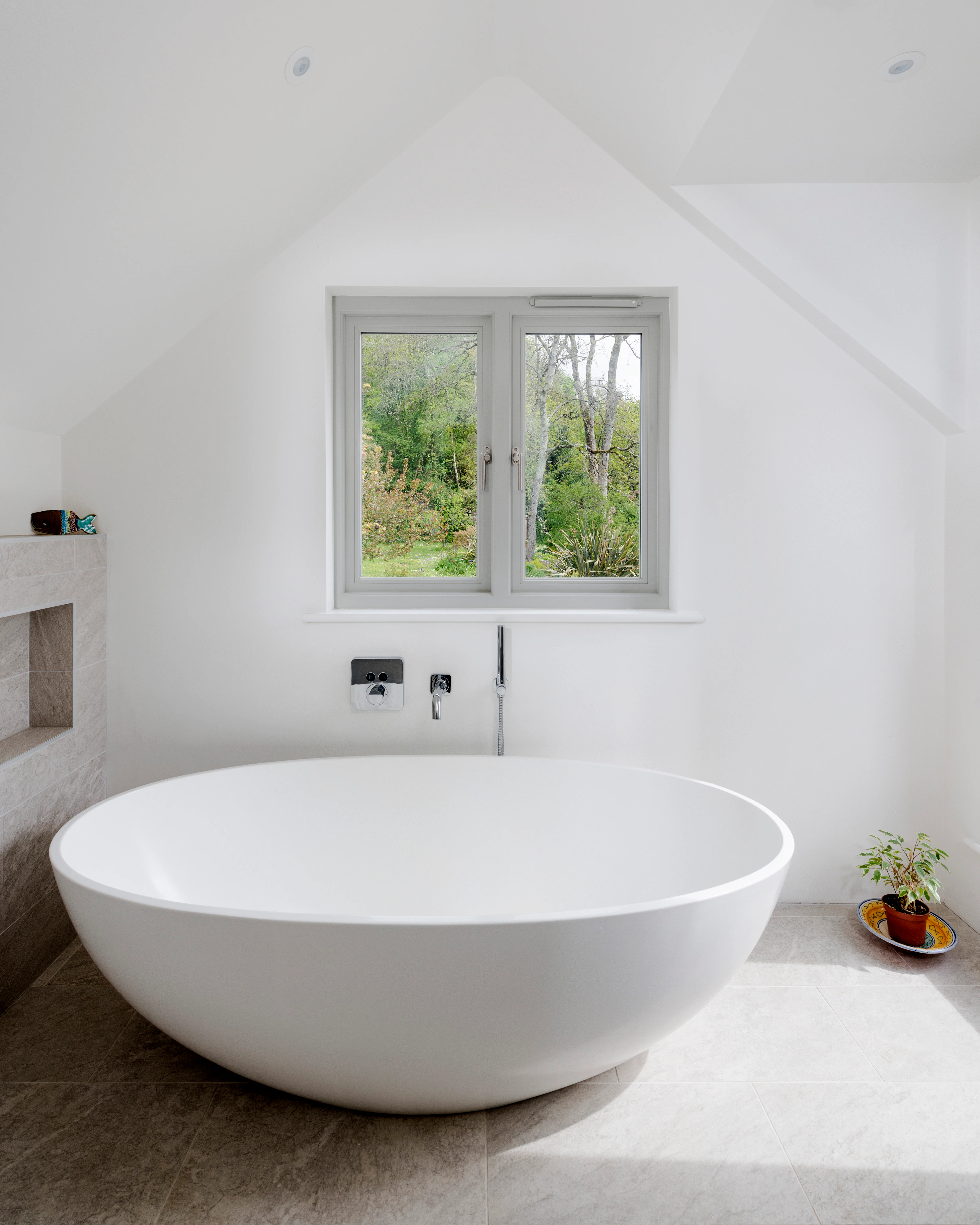 Interior view of a bathroom featuring a freestanding elegant bathtub