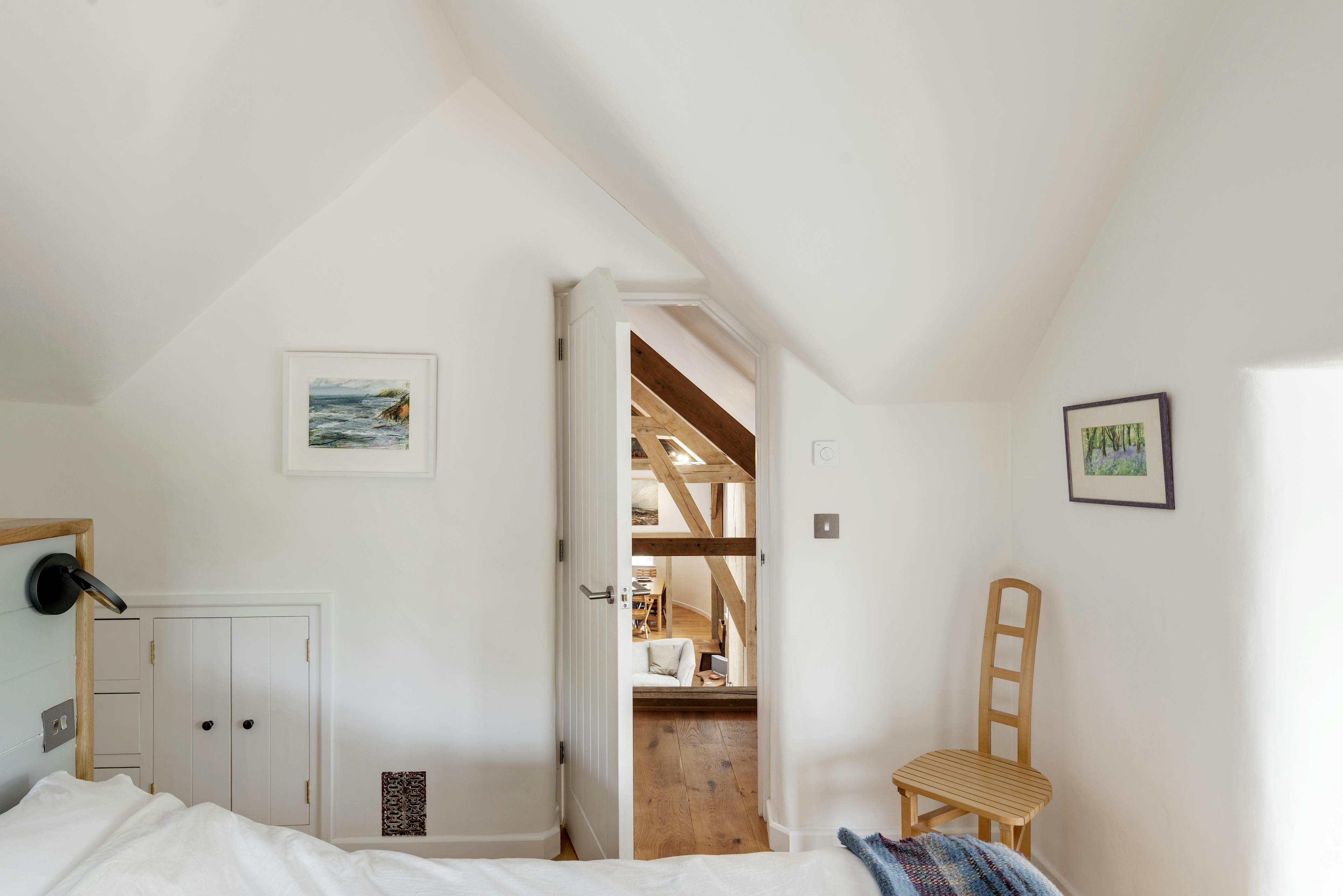 Interior view of a bedroom with a view of the exposed oak-framed lounge