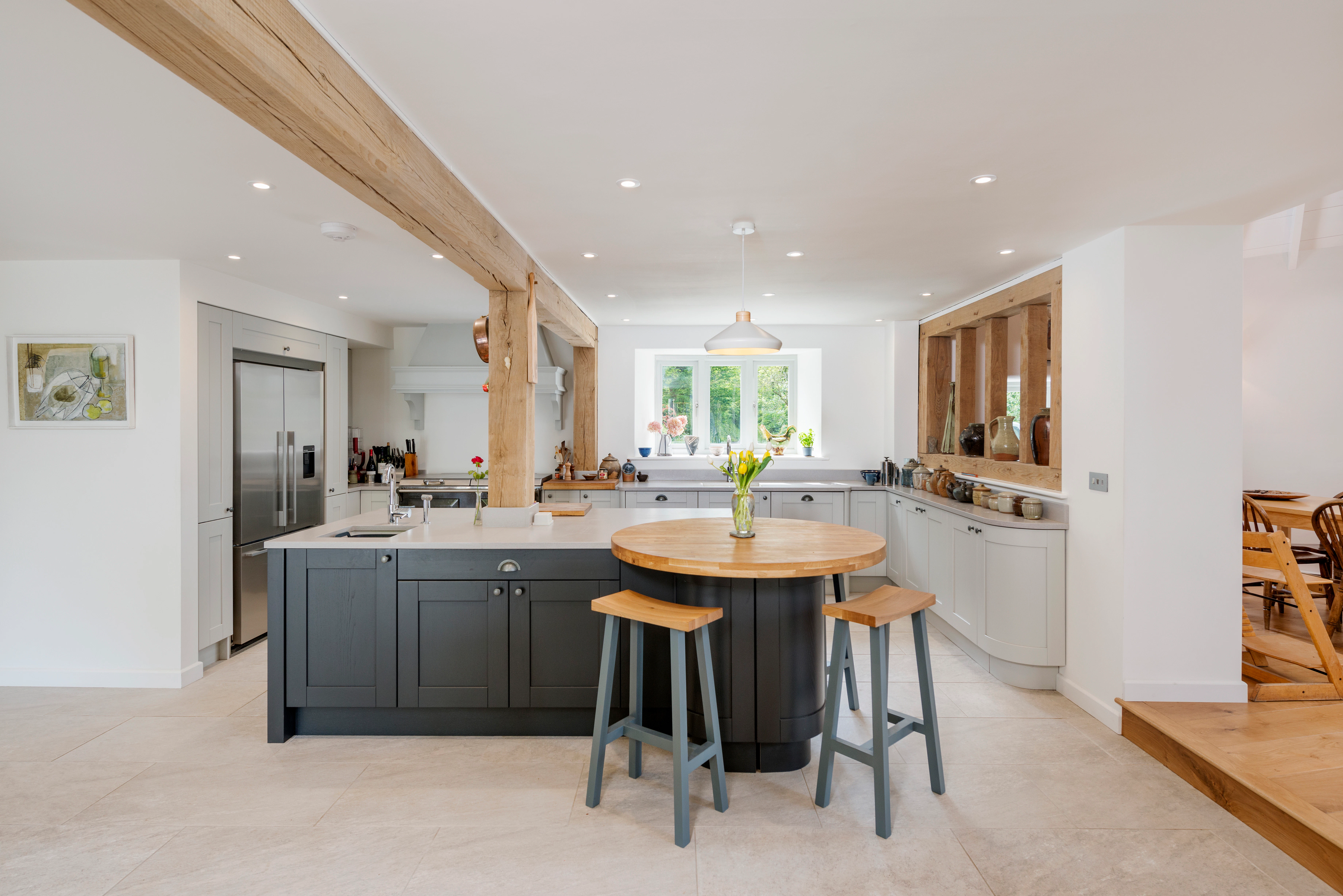 Interior view of a contemporary kitchen showcasing oak-framed details that harmonise with the overall design of the house