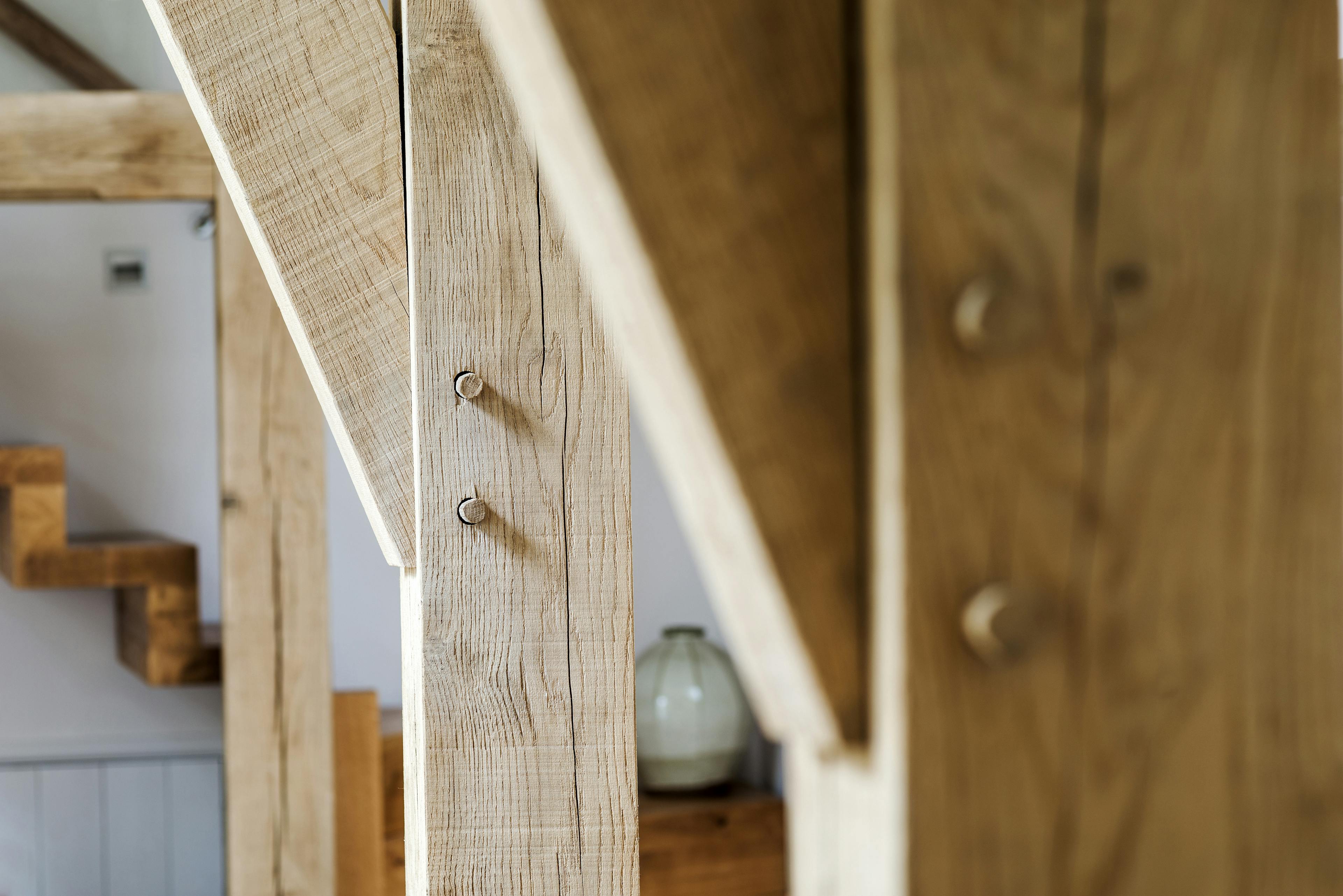 Close-up of a traditional mortise and tenon joint on a slice-braced truss