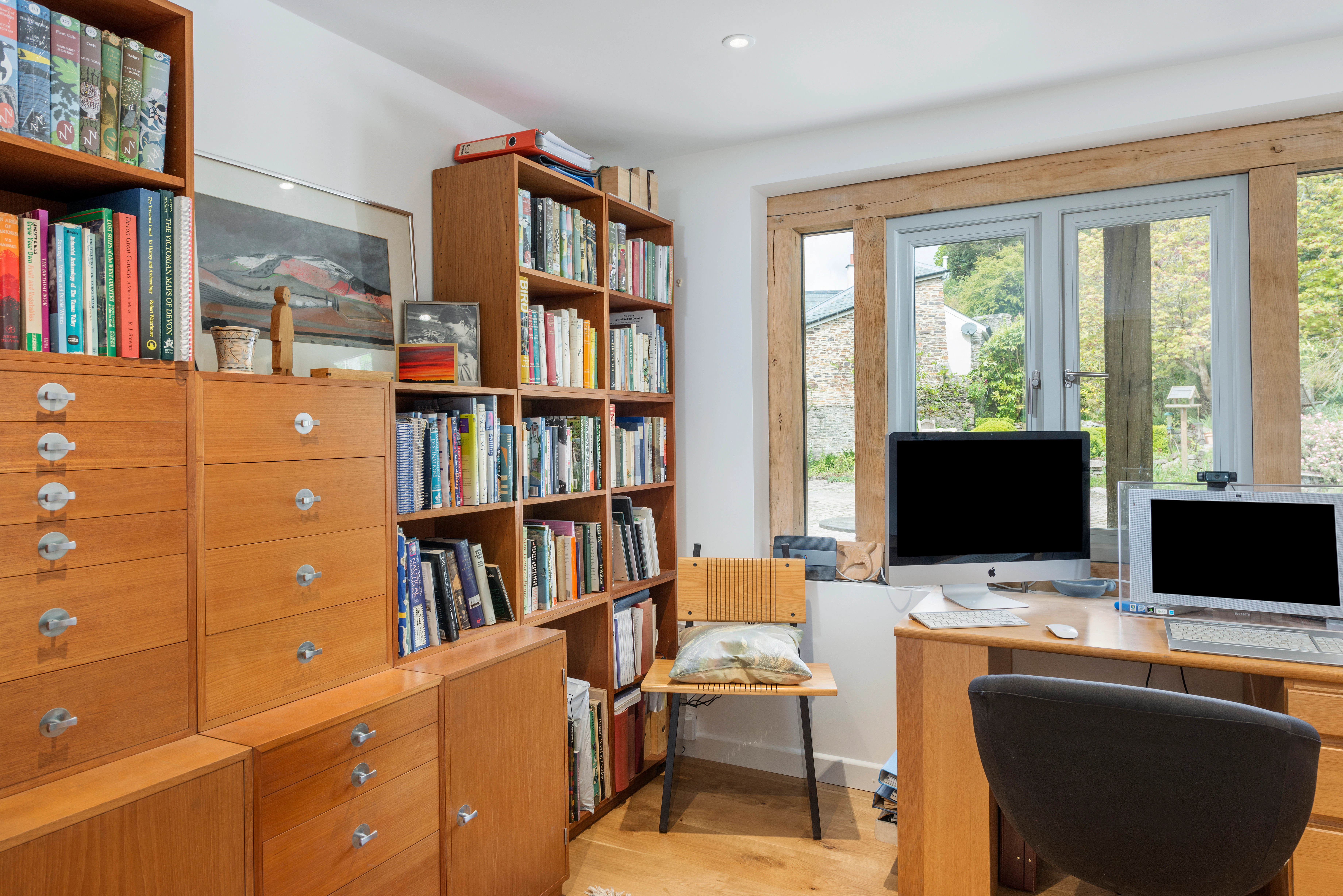 Interior view of an office featuring oak-framed, direct-glazed windows that enhance the natural light