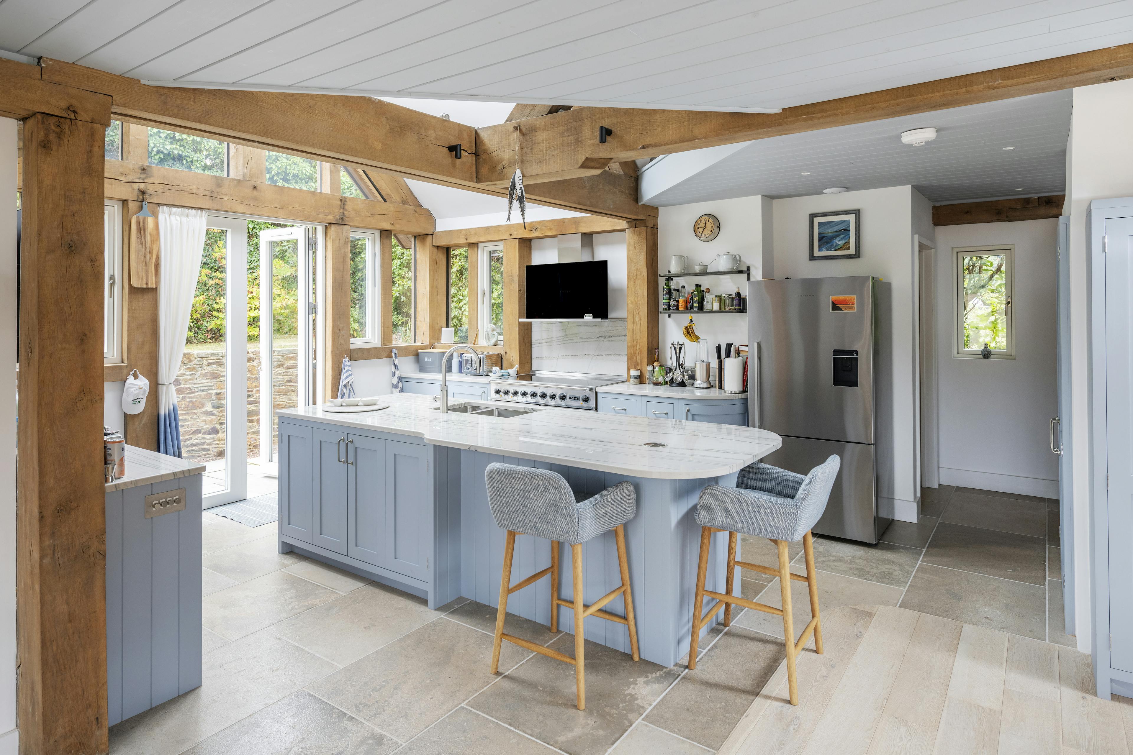 A modern well-finished oak frame kitchen with a large island