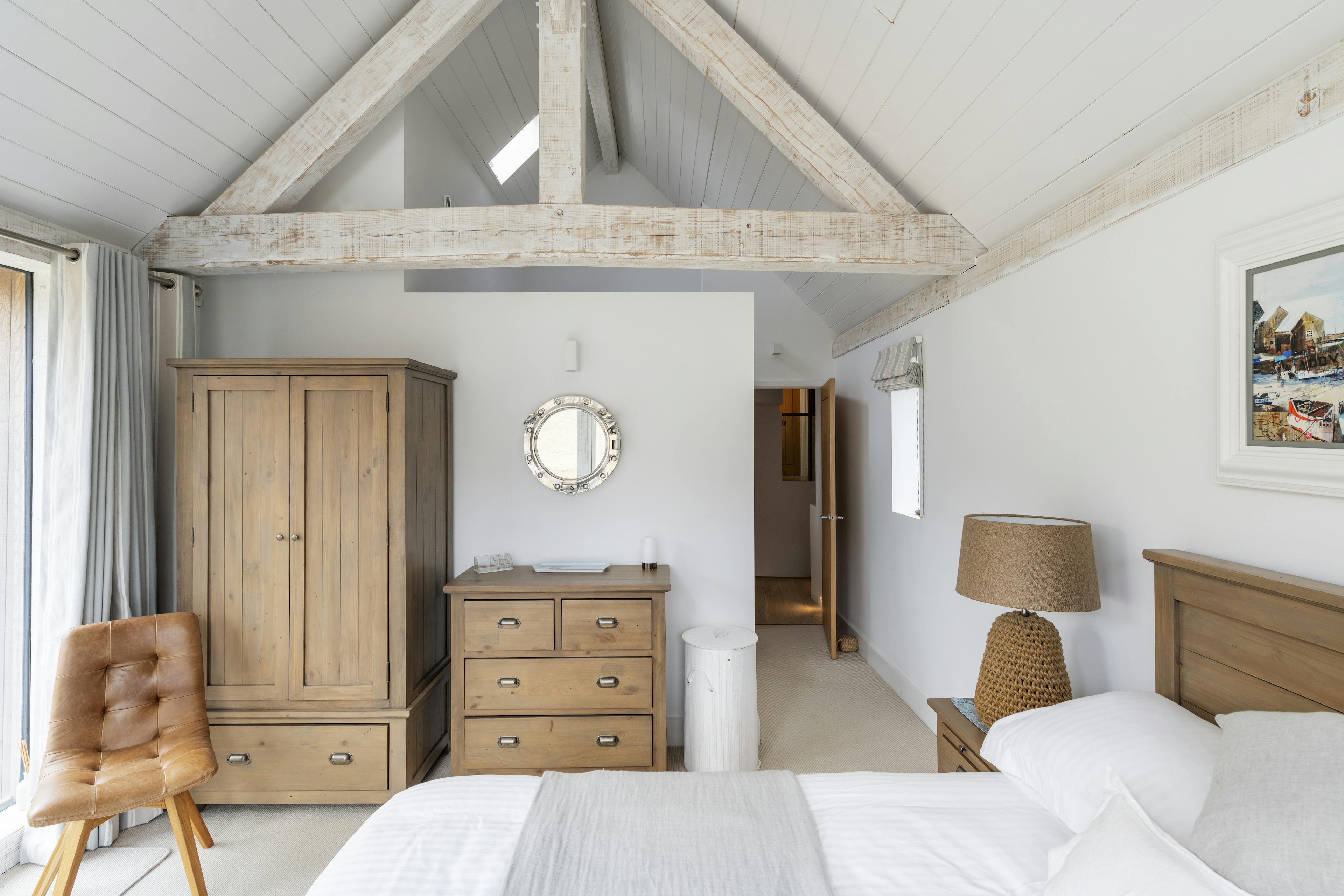 A modern painted Douglas fir framed bedroom
