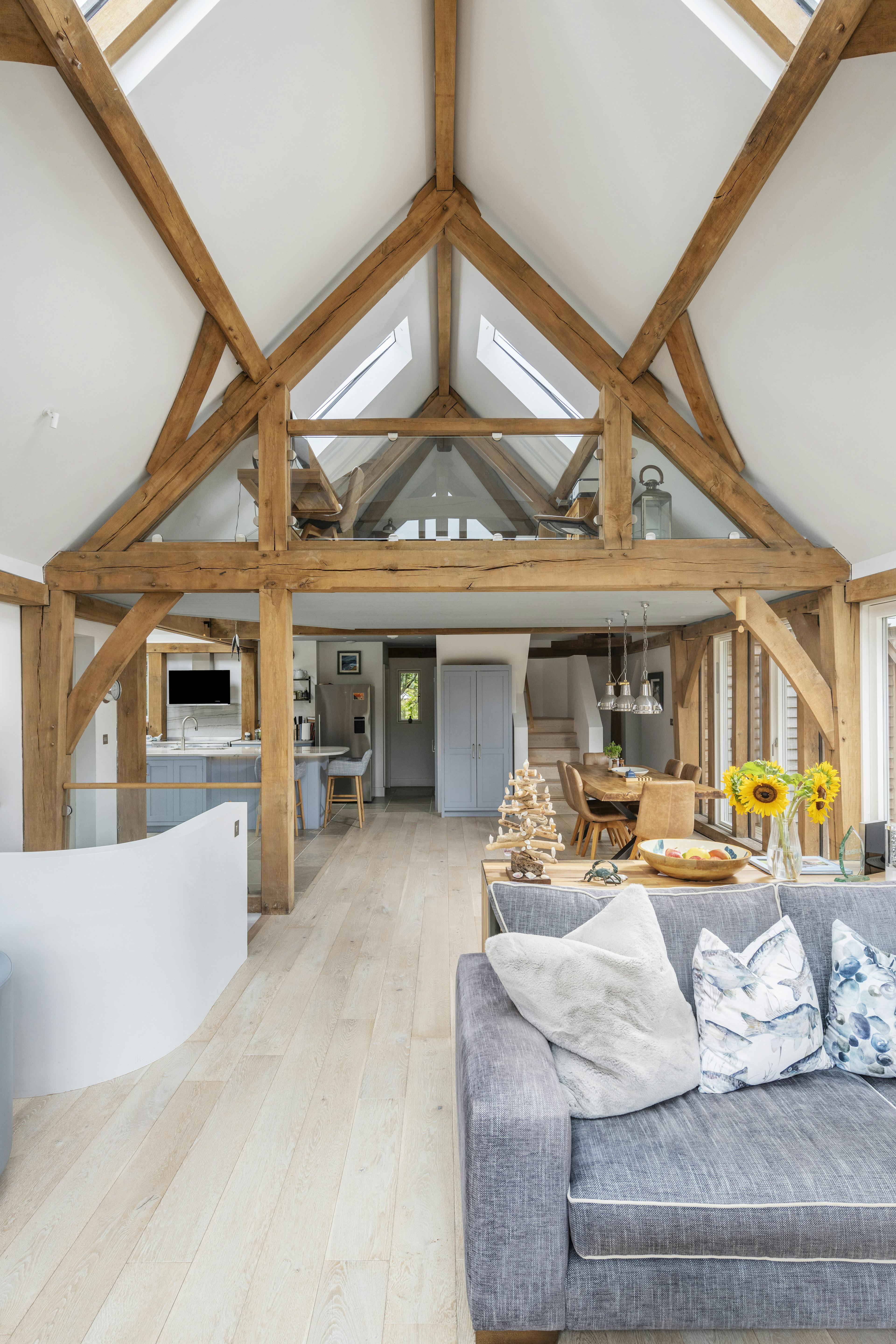 A modern, light filled oak framed home with rooflights, showing an open plan living area