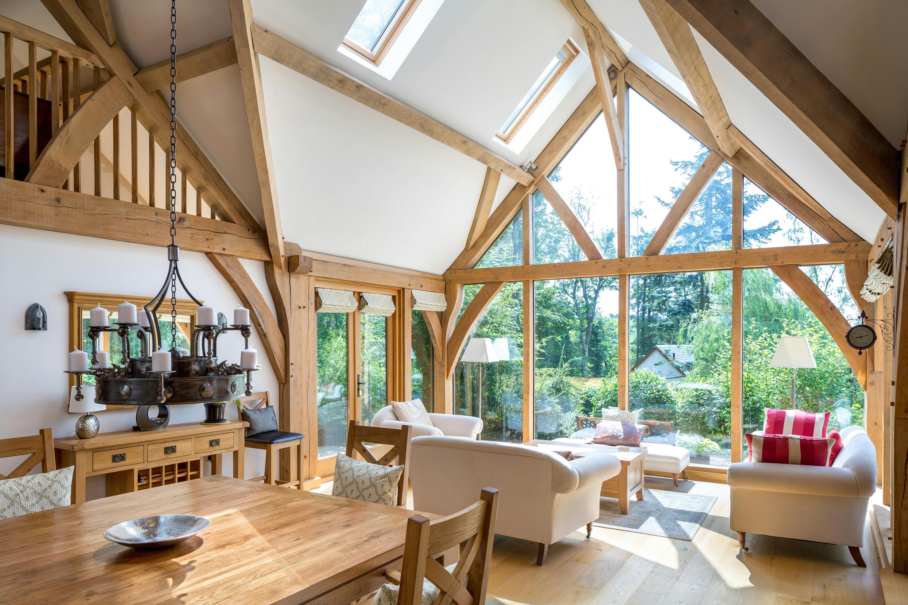 Oak framed living room with a large glazed gable end sitting area and dining table
