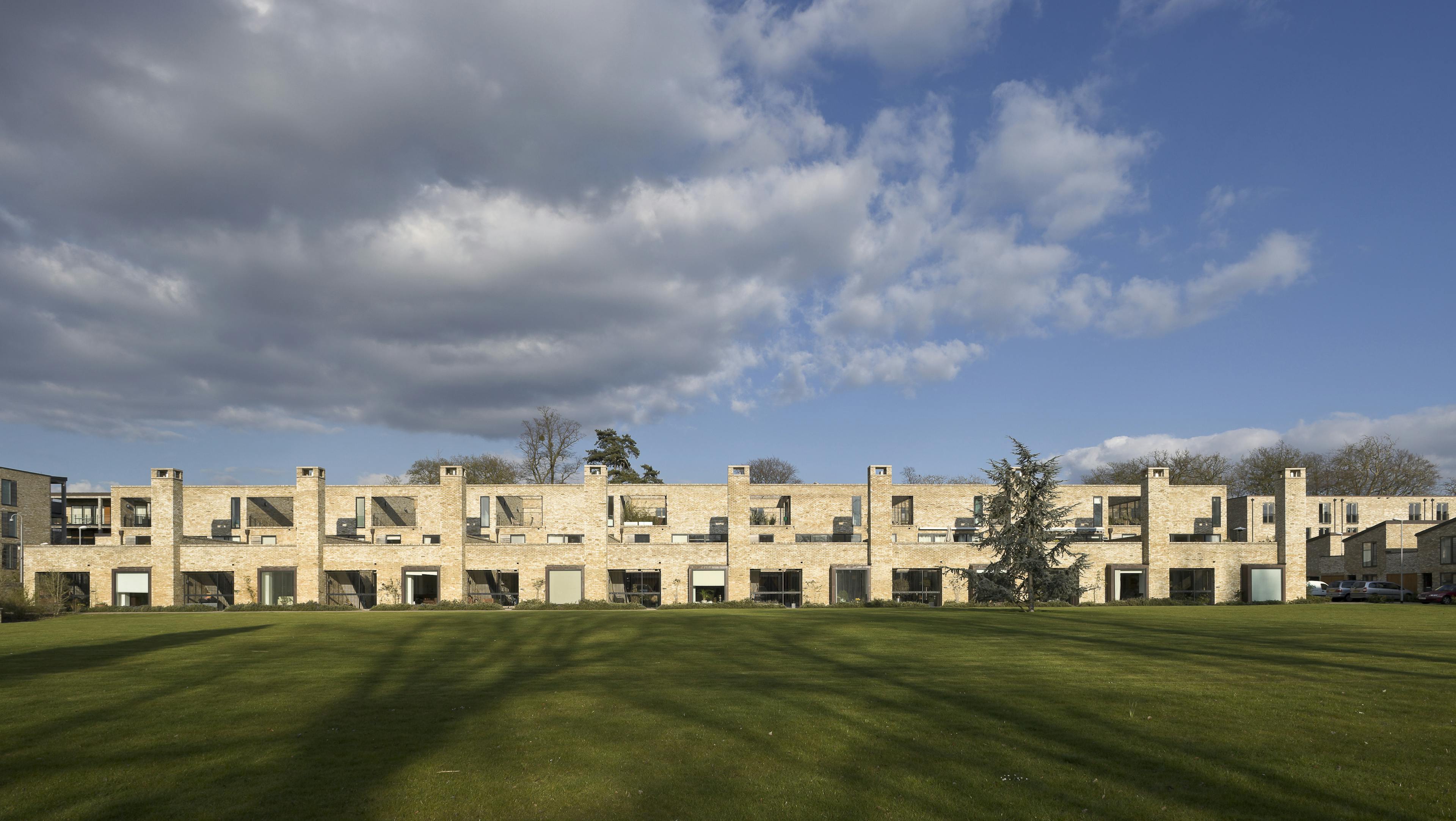 Exterior view of innovative houses and apartments featuring a harmonious balance between private and public spaces