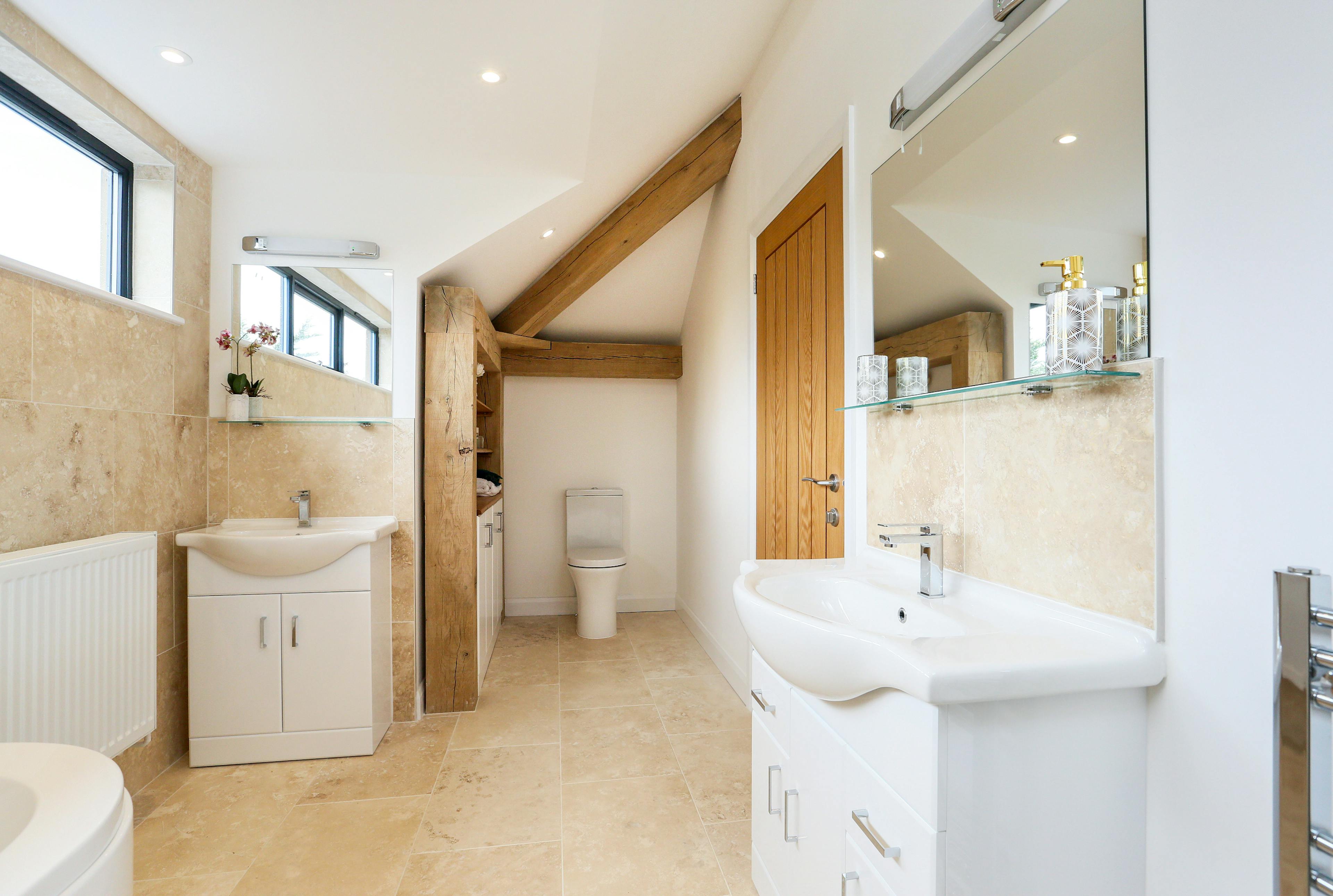 A modern bathroom with an oak frame