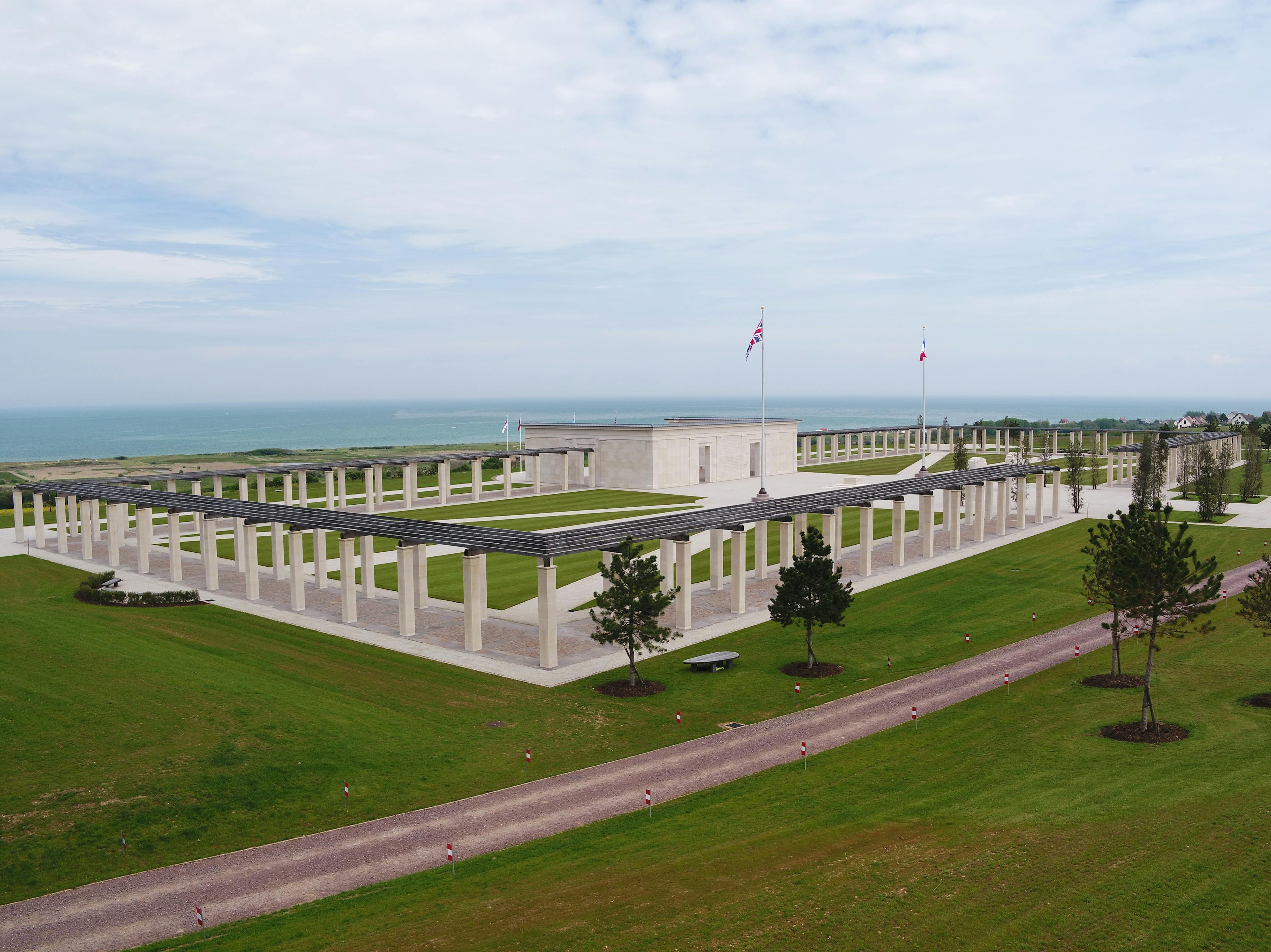 A view of the British Normandy Memorial made up of stone columns with an oak pergola