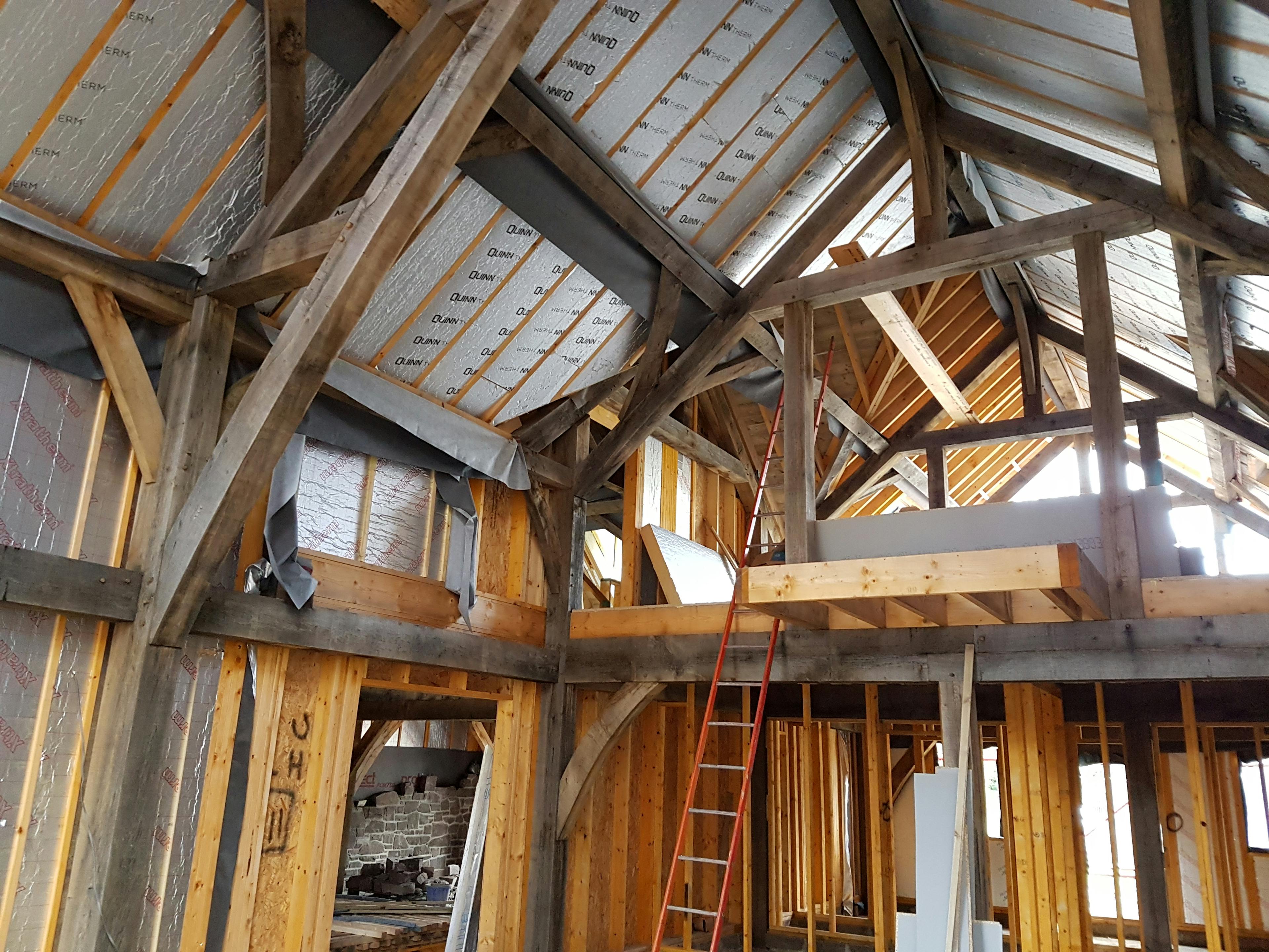 The inside of an oak framed building during the construction process