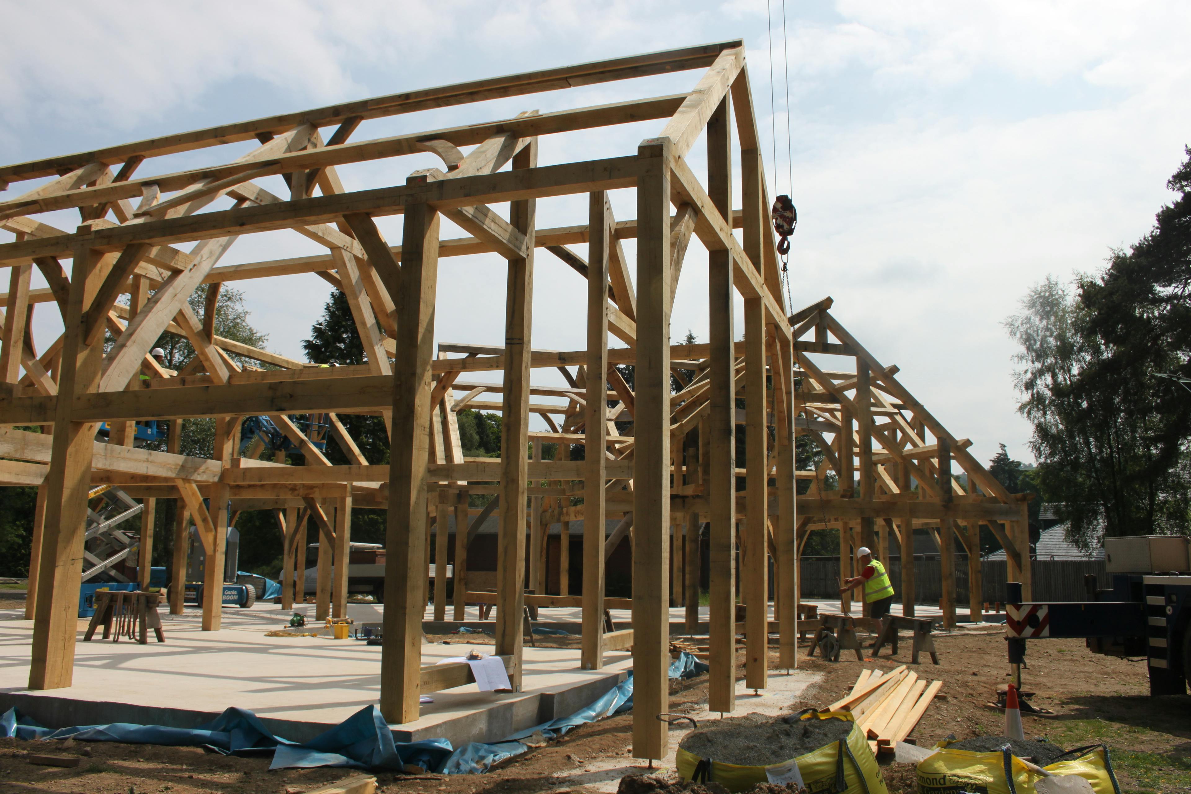 The installation of two oak framed houses on a construction site