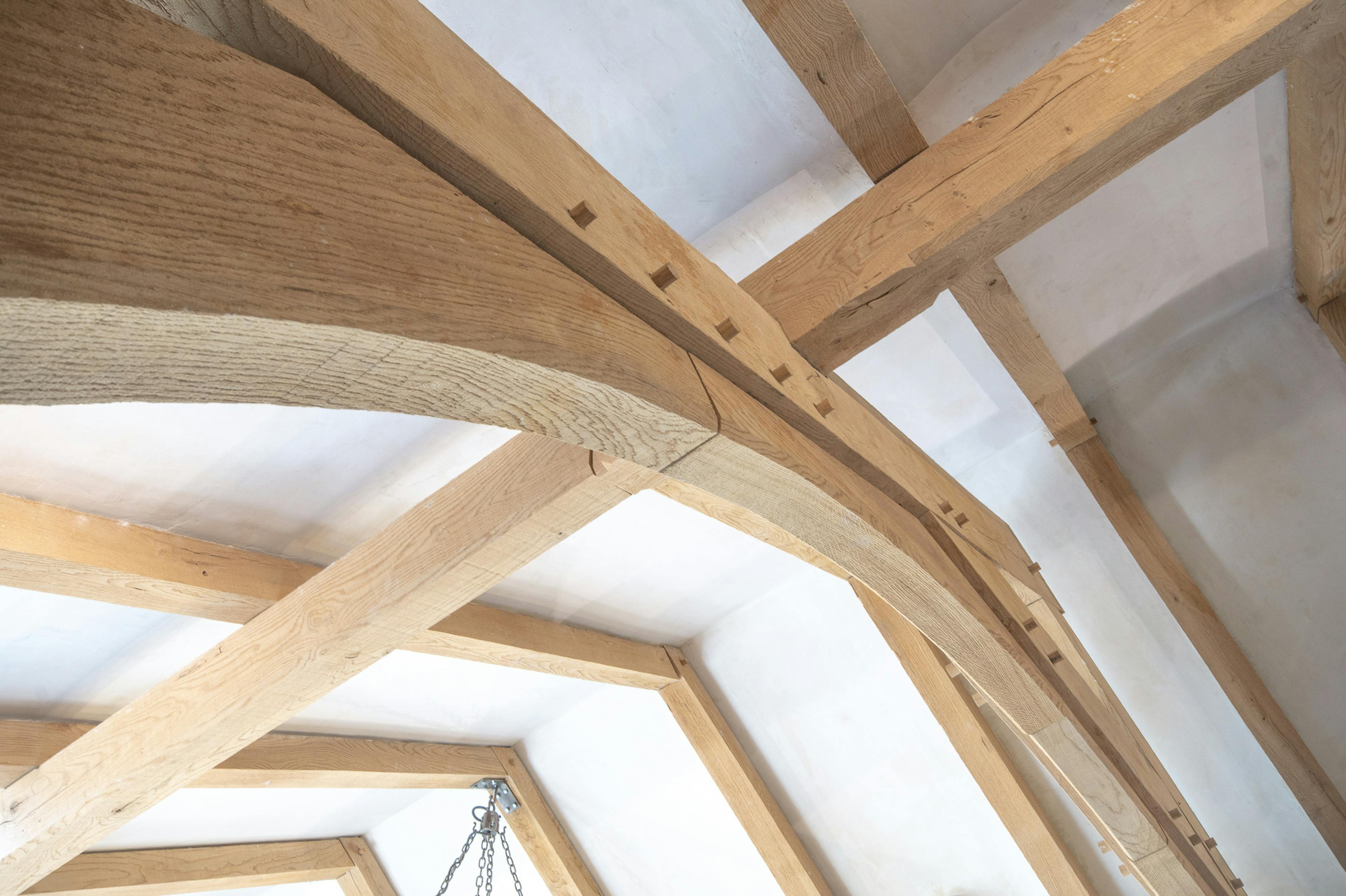 A close up an oak framed truss in a dining room extension to a pub