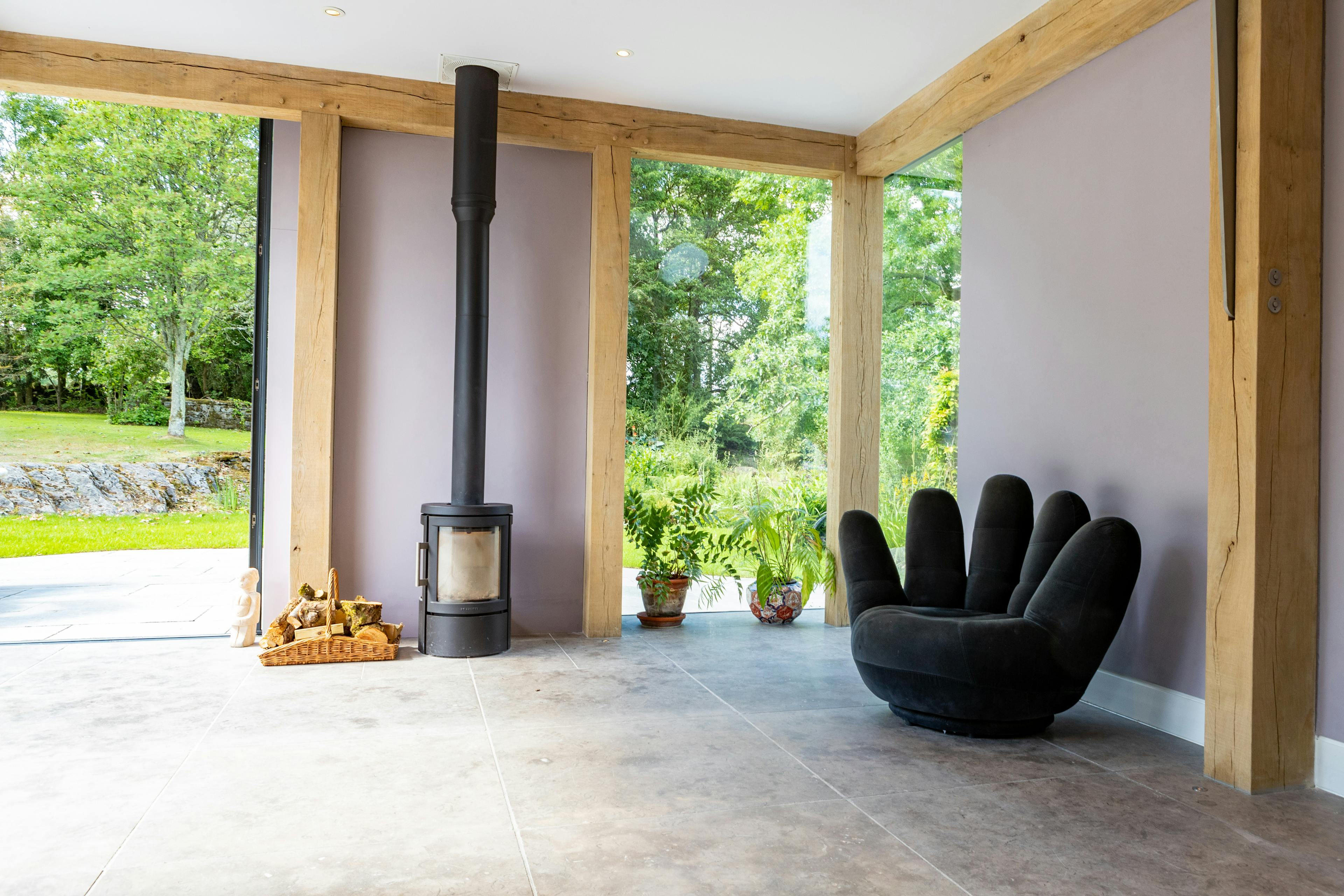 An oak frame living room extension with a log burner