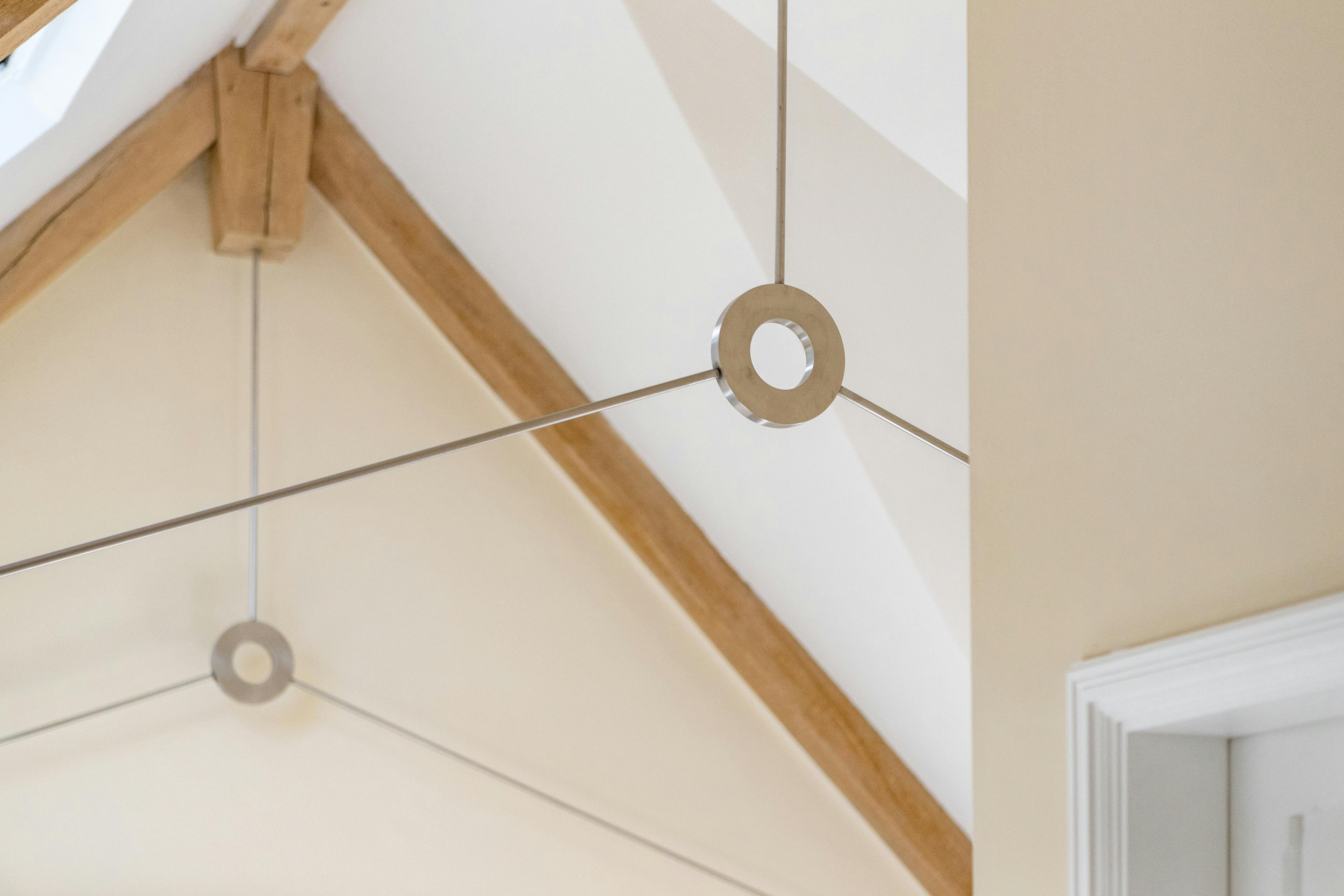 Oak frame with donut steel tie connections