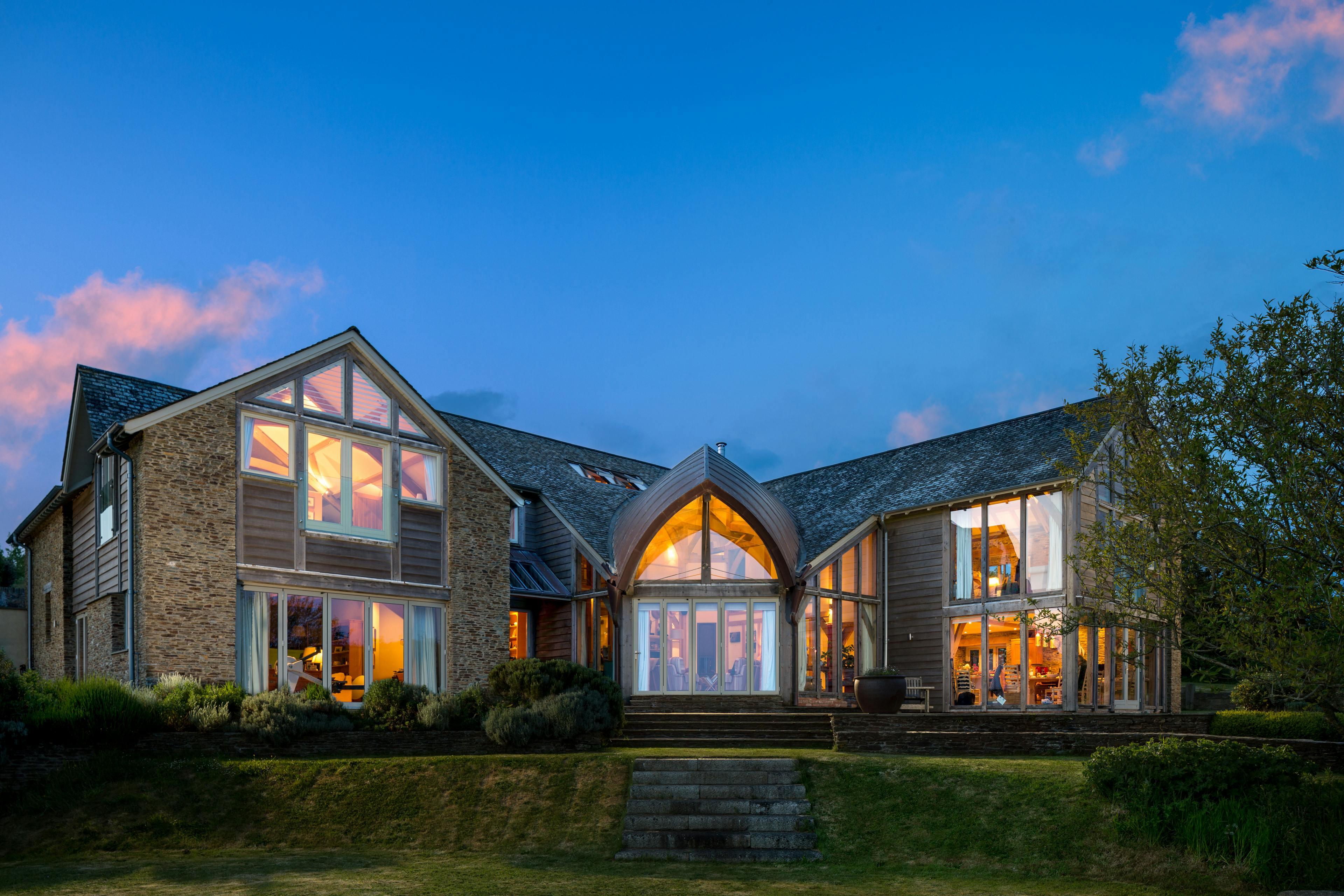 Nighttime view of a charming two-story oak-framed family home