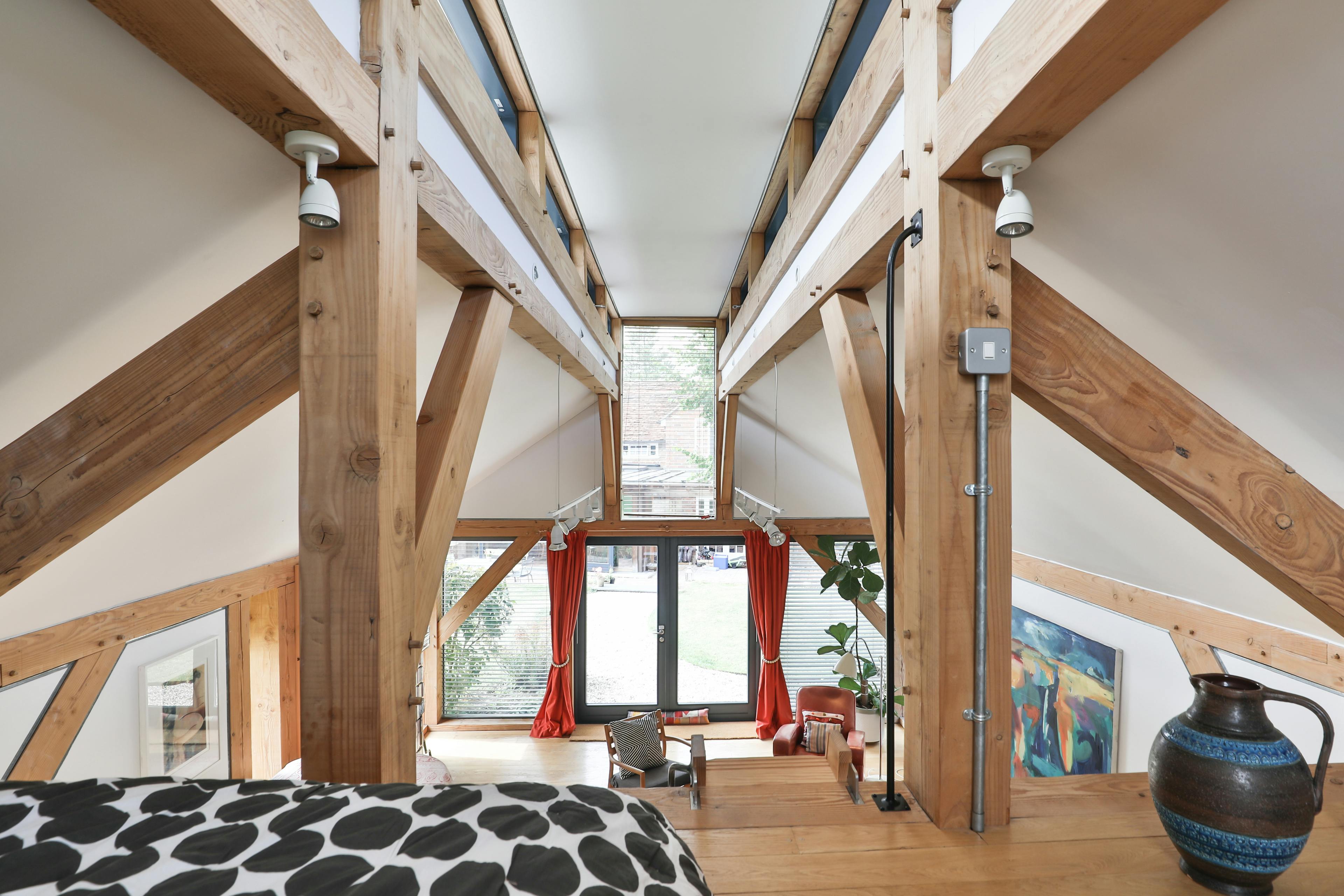 The mezzanine sleeping area in a Douglas fir framed annex