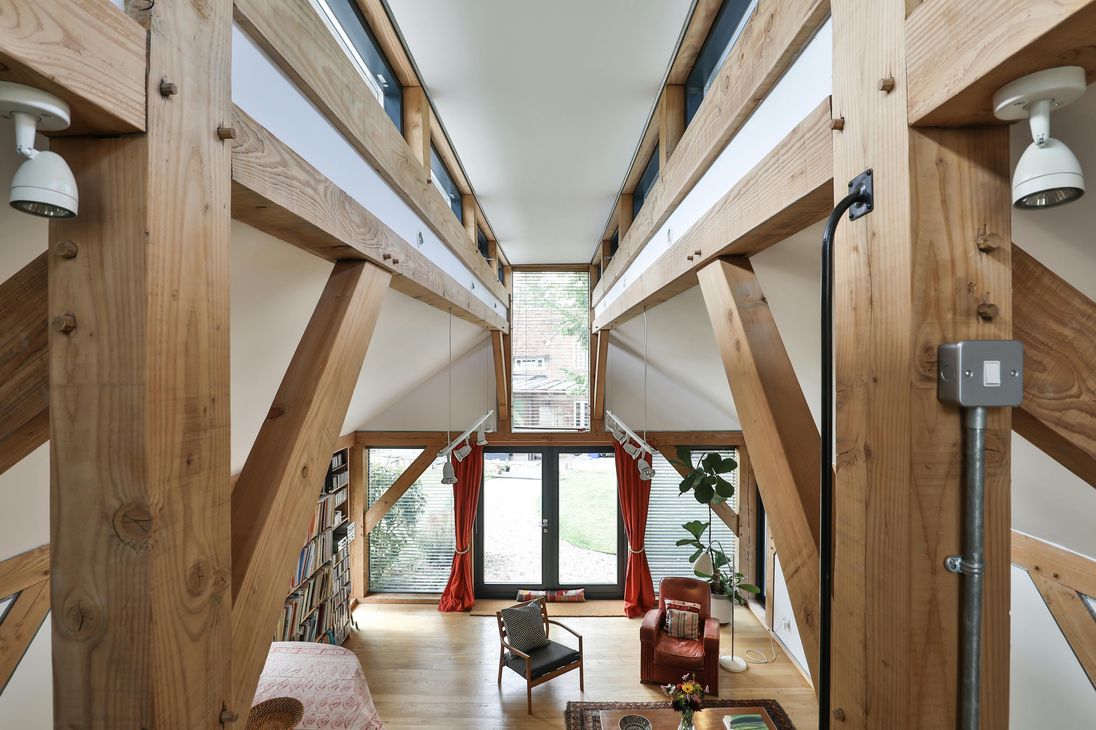 A mezzanine space above an open plan Douglas fir framed living room