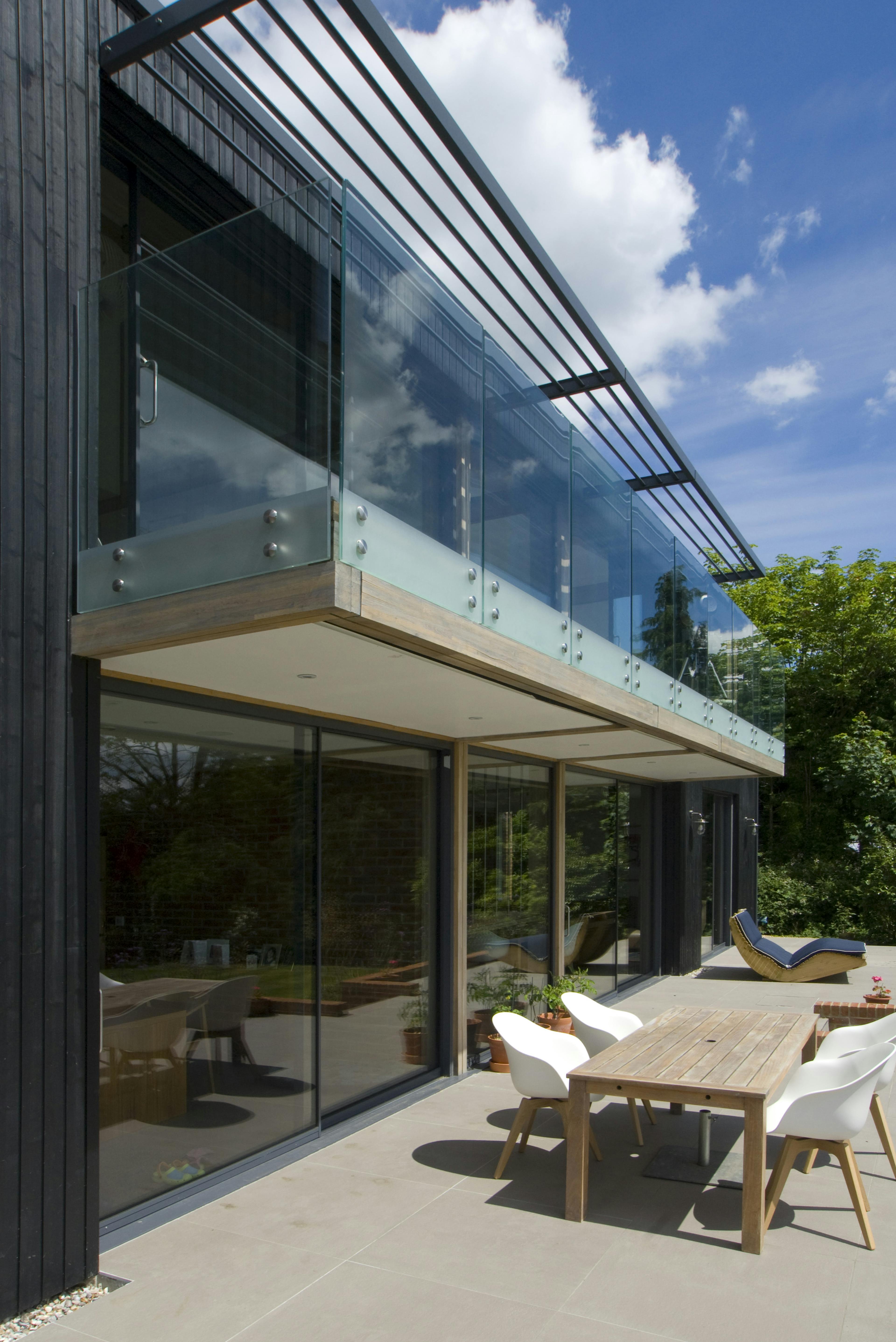 The back of an oak glulam house with external balconies