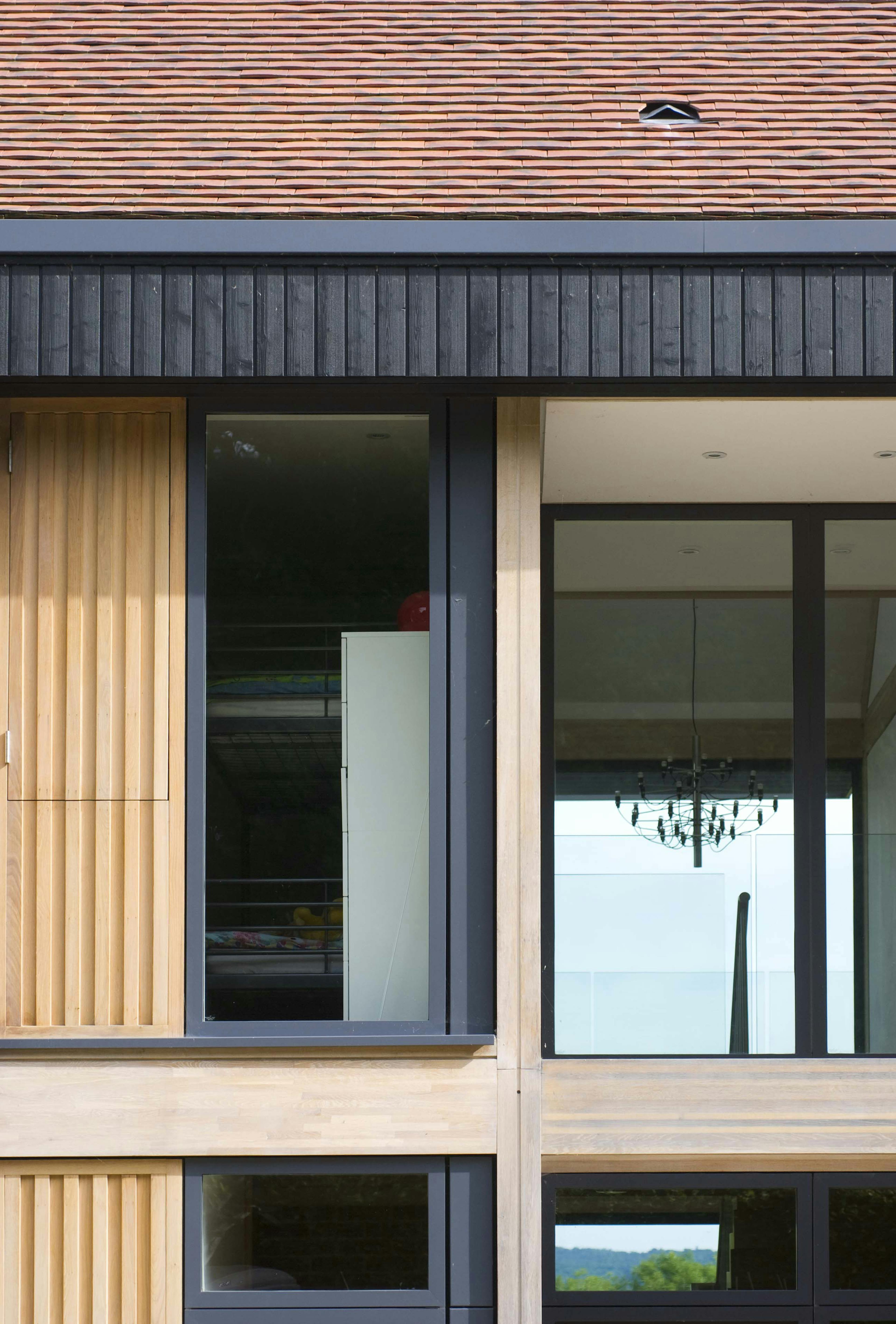 A close up image of windows on an oak glulam house