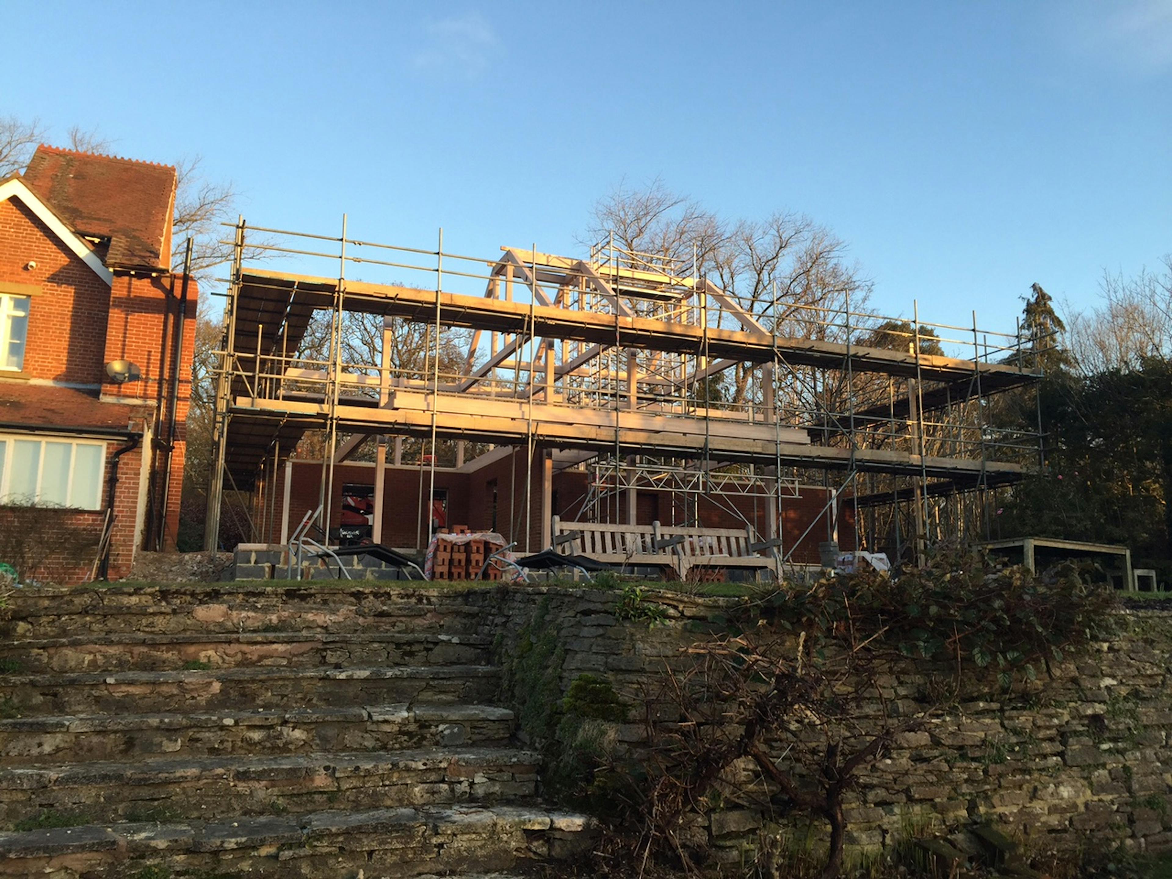 An oak glulam house during construction